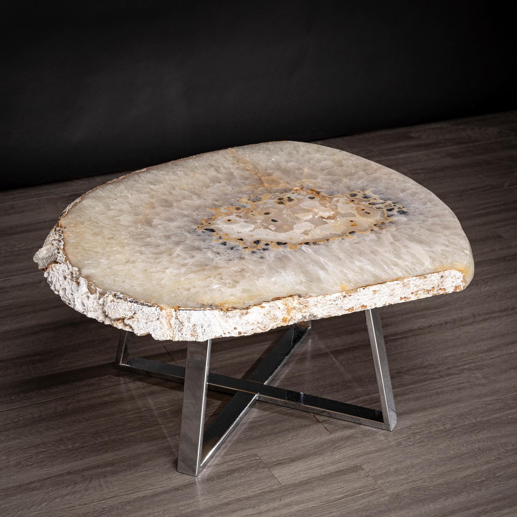 This agate slab forming a side table or cocktail table, is from Brazil and has a combination of colors with hints of grey and white. Agates are formed in rounded nodules, which are sliced open to bring out the internal pattern hidden in the stone.