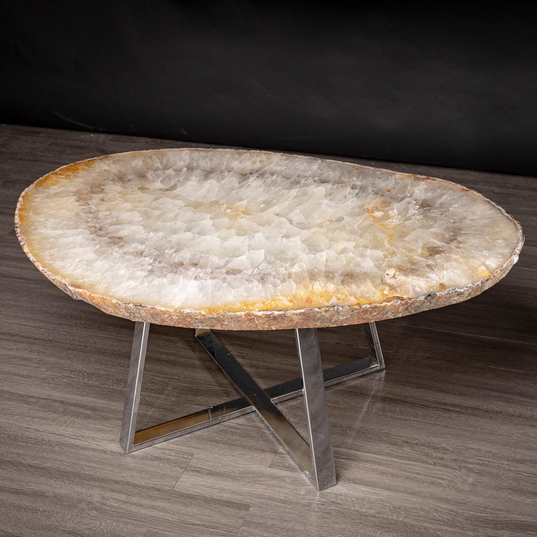 This agate slab forming a side table or cocktail table, is from Brazil and has a combination of colors with hints of grey and white. Agates are formed in rounded nodules, which are sliced open to bring out the internal pattern hidden in the stone.
