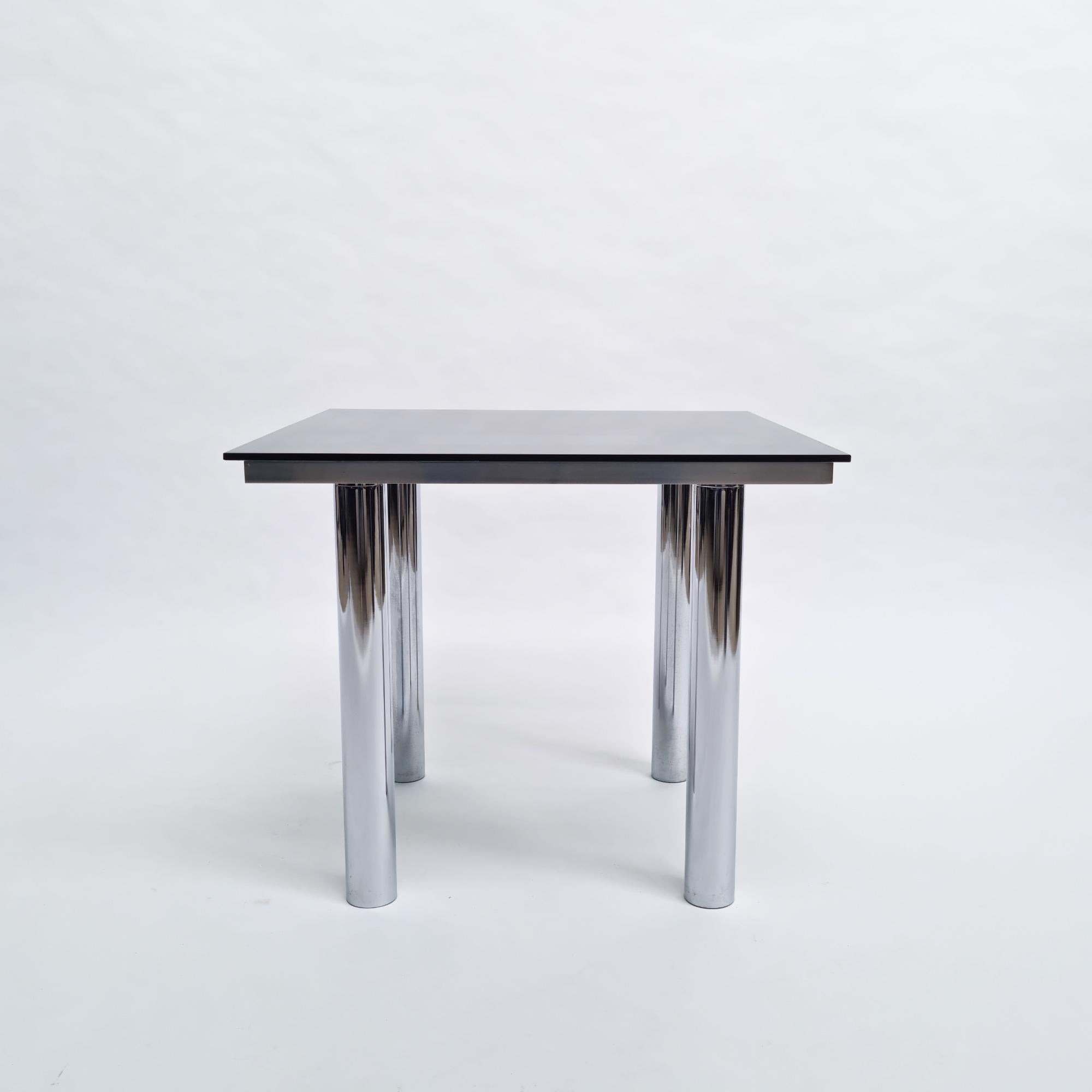Side table model ‘André’ of 1969 created by Tobia Scarpa and manufactured by Knoll International/De Coene. Chromed steel structure, adjustable legs, smoked glass.