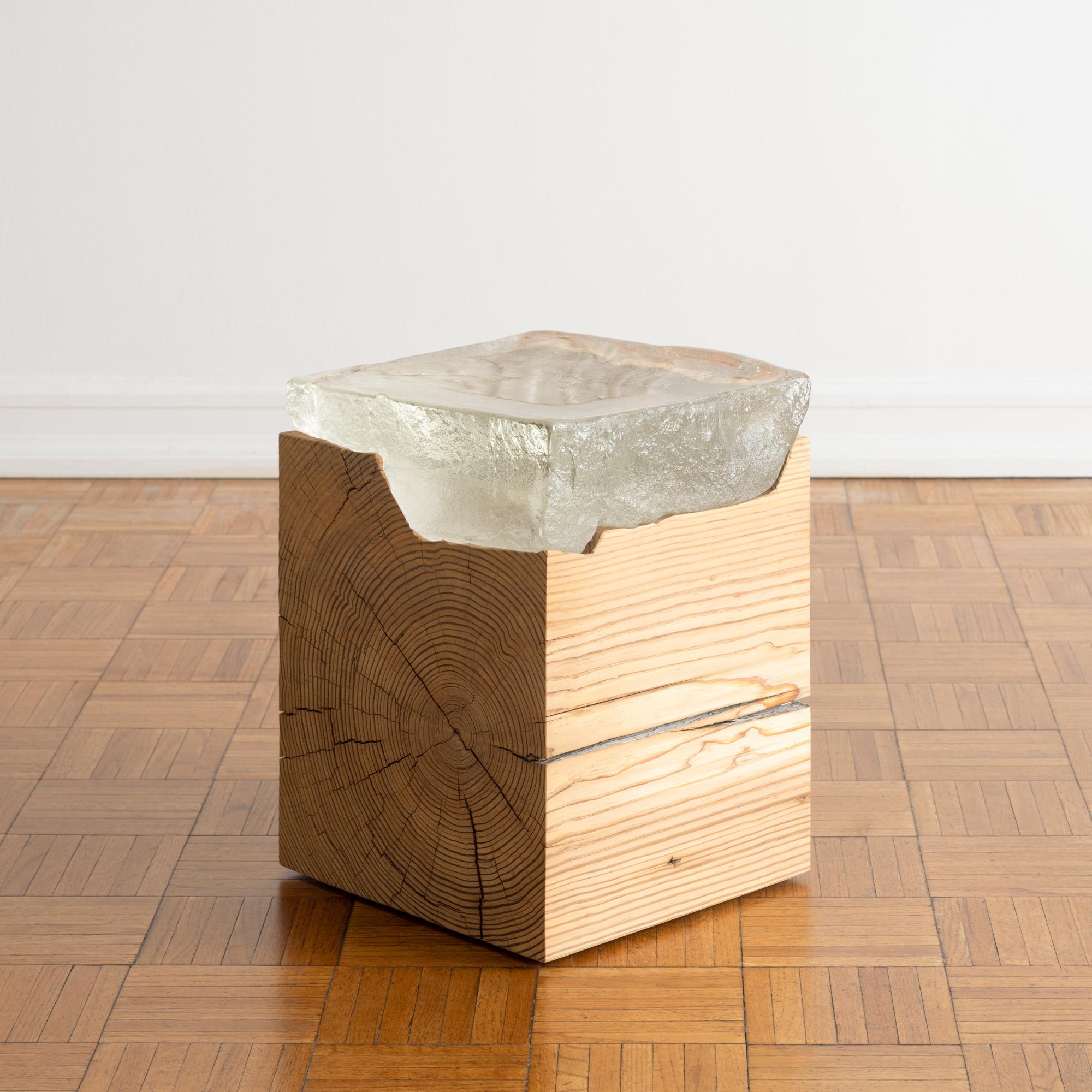 One-of-a-kind side or end table in hand-carved reclaimed wood with cast glass top. Fueled by curiosity while pushing function and materiality to its limits, this piece would make an evocative yet understated sculptural accent to your design project.