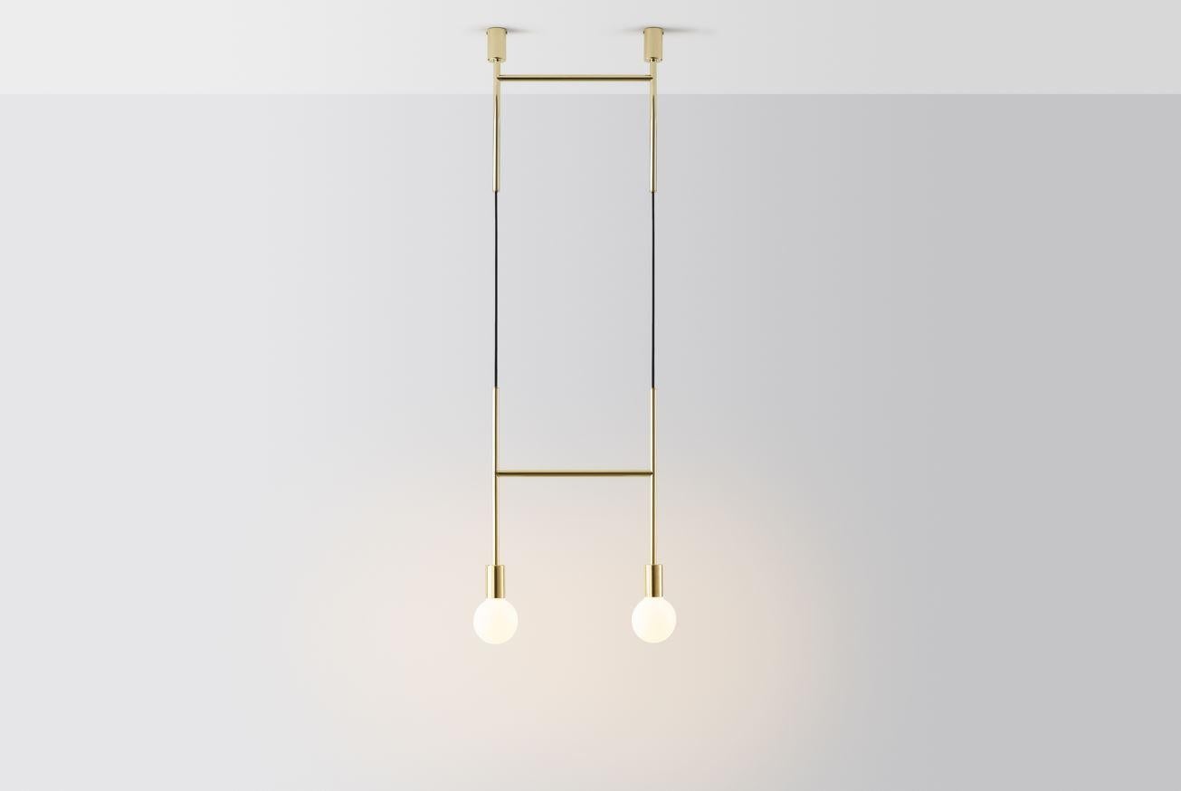 Side step by Volker Haug.
Dimensions: W 45 x H min 108 cm
Materials: Polished, bronzed brass or steel
Cord: Fabric or metal
Finish: Raw, satin lacquer or powdercoat
Weight: approx 2.3 kg

Lamp: 240V E27 (120V E26 US) 
Custom finishes