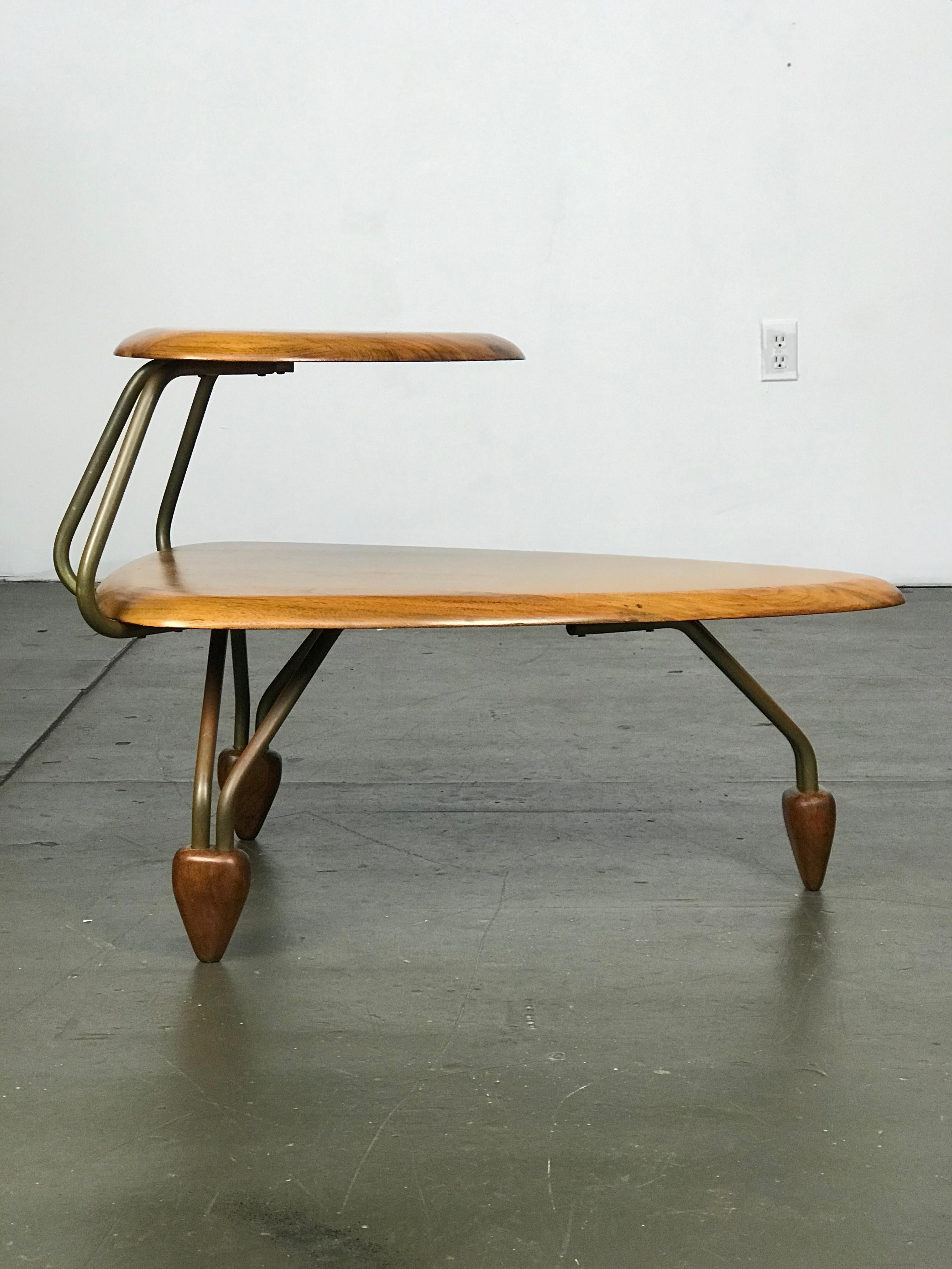 Wonderfully designed side/step table in walnut and brass plated metal, often attributed for John Keal for Brown Saltman, although I am not sure of that. I am listing it as maker unknown, but I have loved this design since I got into the business