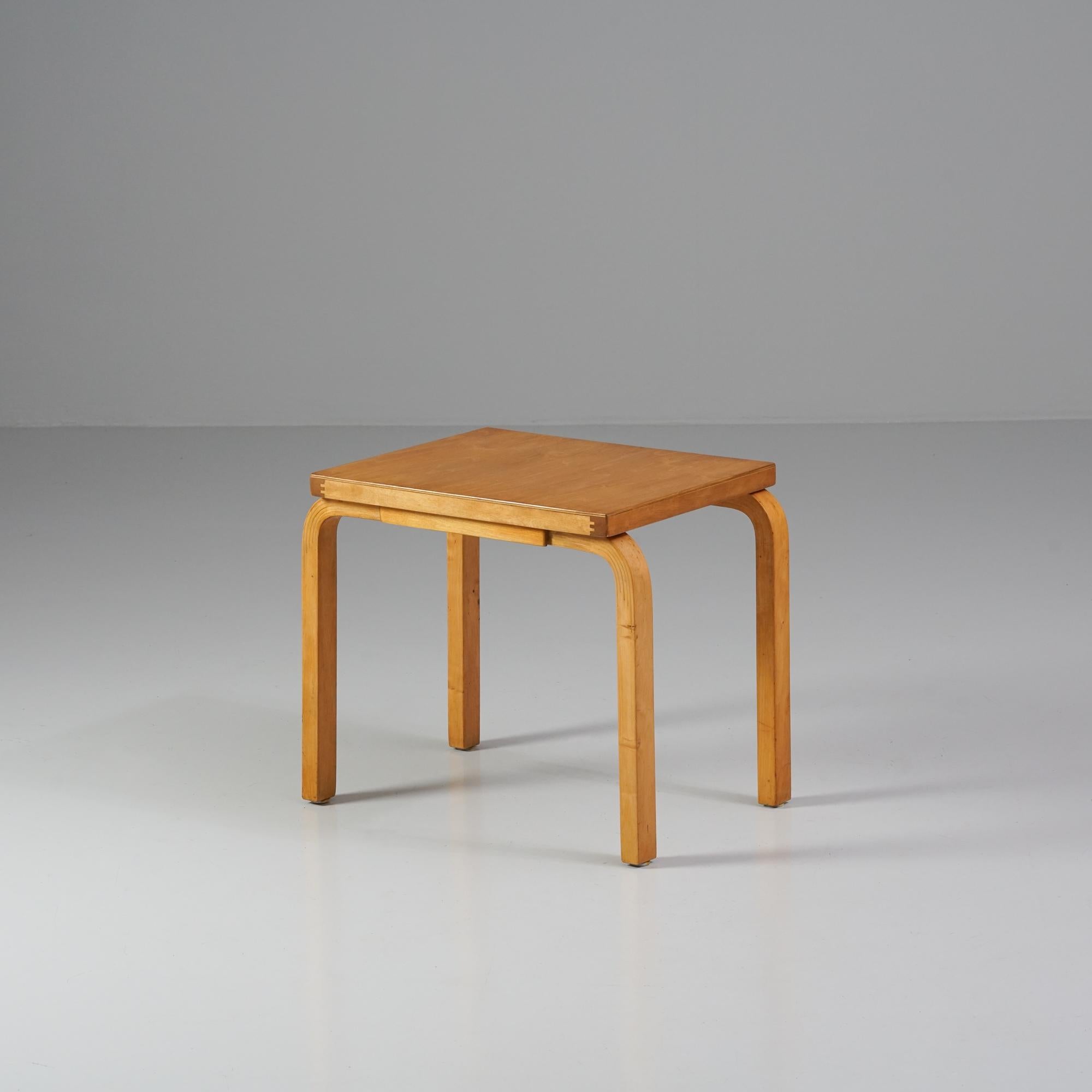 Side table / part of a nesting table, designed by Alvar Aalto, manufactured by Oy Huonekalu- ja Rakennustyötehdas Ab, 1950s. Birch. Good vintage condition, patina consistent with age and use. 
