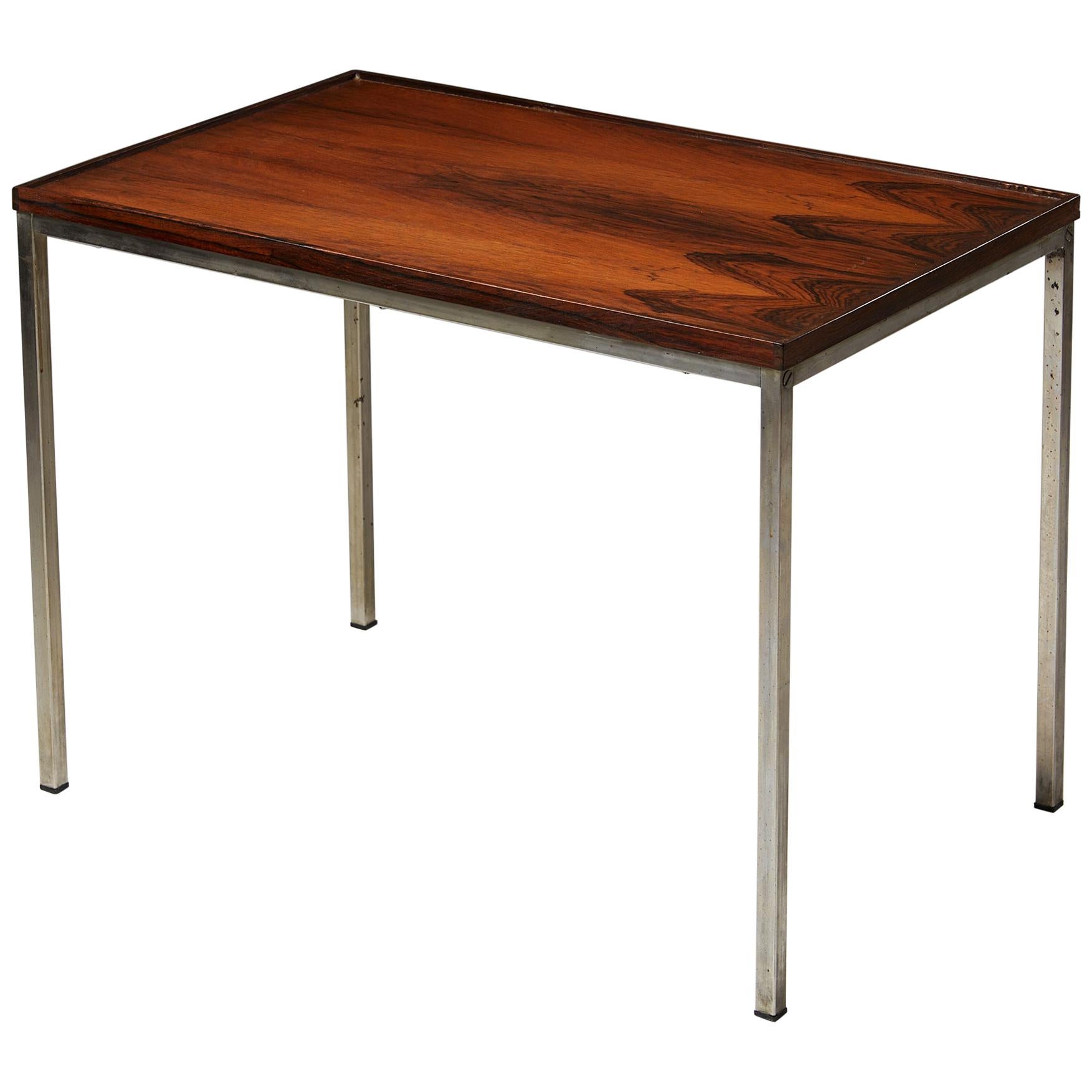 Side table, anonymous,
Sweden, 1960s.

Rosewood with metal frame and legs.

Dimensions:
L: 63 cm/ 2' 3/4