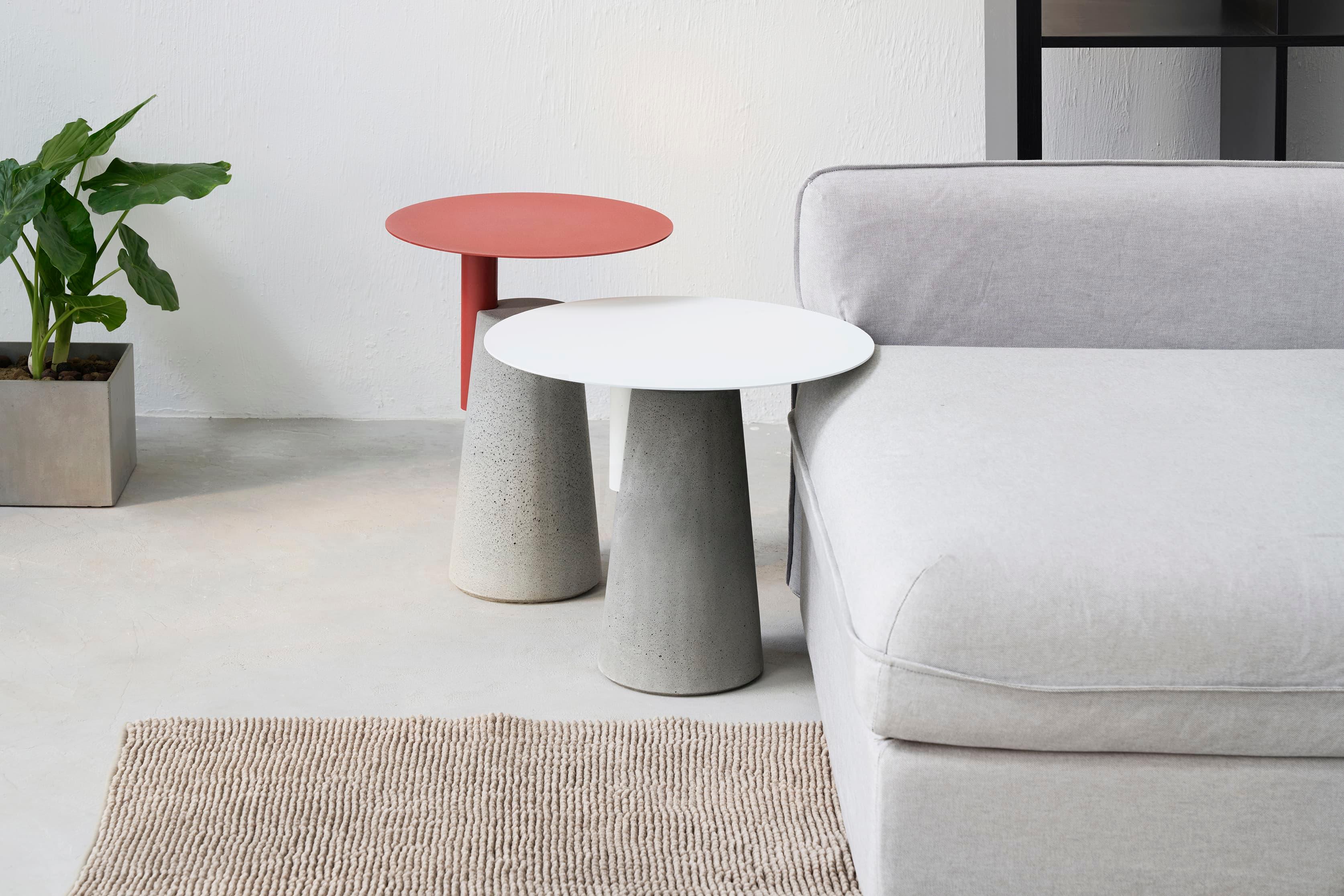 'BAI' is a collection of side table
by Bentu Design

Table top: steel
Table base: concrete

3 sizes available: 
- Small H 45 cm, D 50 cm
- Medium H 52 cm, D 40 cm
- Large H 60 cm, D 45 cm

3 colors available: 
Black
White
Red

Bentu