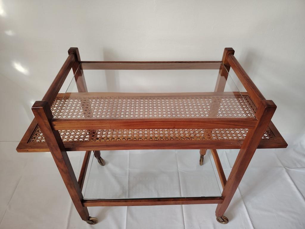 Solid walnut construction with caned shelf and glass table top designed by Julius Jirasek for Werkstätte Karl Hagenauer, Vienna, circa 1957.
Original condition.
