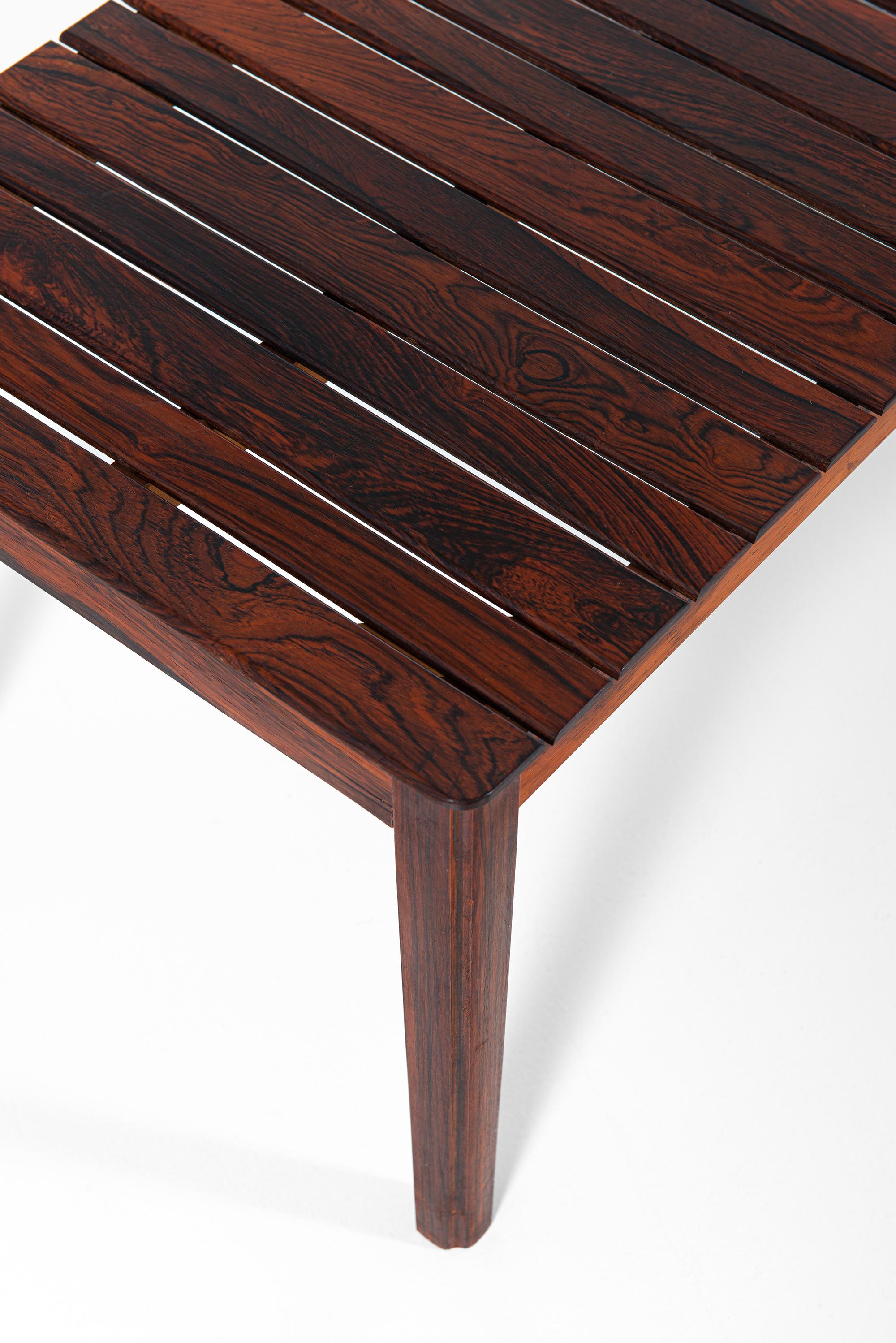 Rare side table / bench in solid rosewood. Produced by Alberts in Tibro, Sweden.