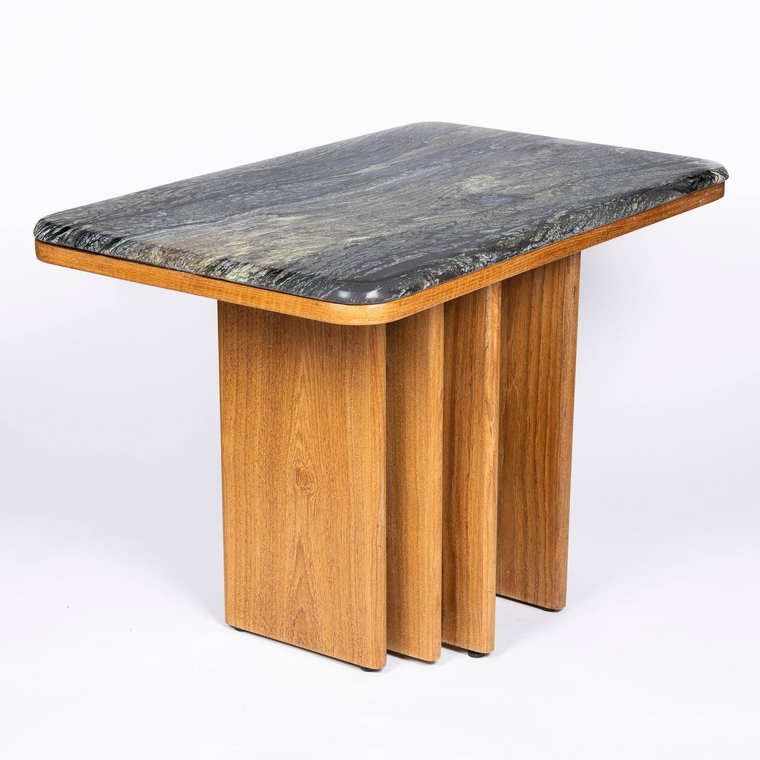 A 1970s side table with Gneiss top by Bendixen Design of Demark.


Gneiss is a coarse-grained metamorphic rock showing compositional banding, the minerals in gneiss are arranged into layers that appear as bands in cross section, this is called