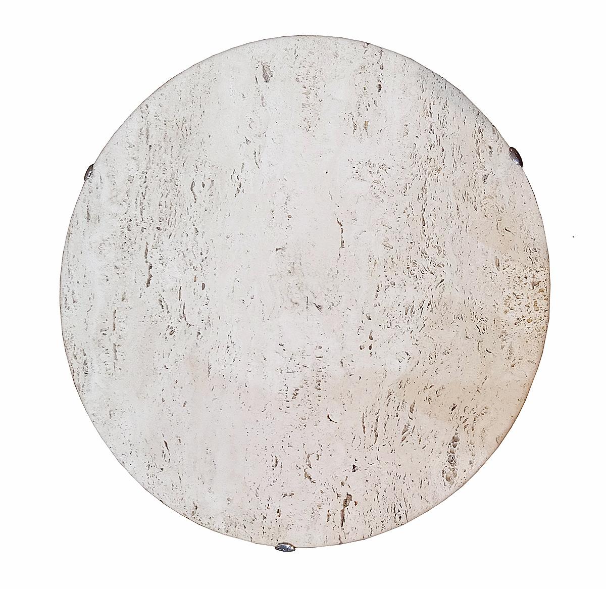The AE table, by renowned designer Cedric Hartman. Travertine marble round top, nickel-plated brass base, with engraved manufacturer's marks and signature. 

Created in 1973, the 