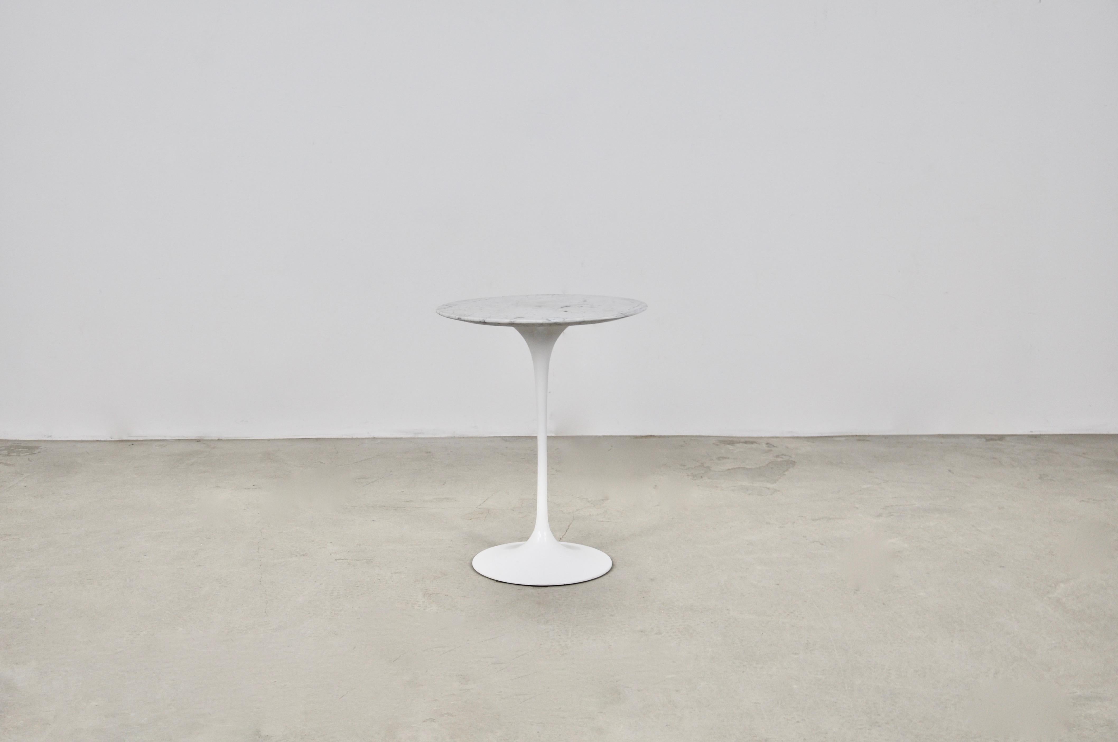 Marble and metal side table by Eero Saarinen. Stamped on the bottom of the leg. Repaired dents in the marble (see photos).  Wear due to time and age of the table.
