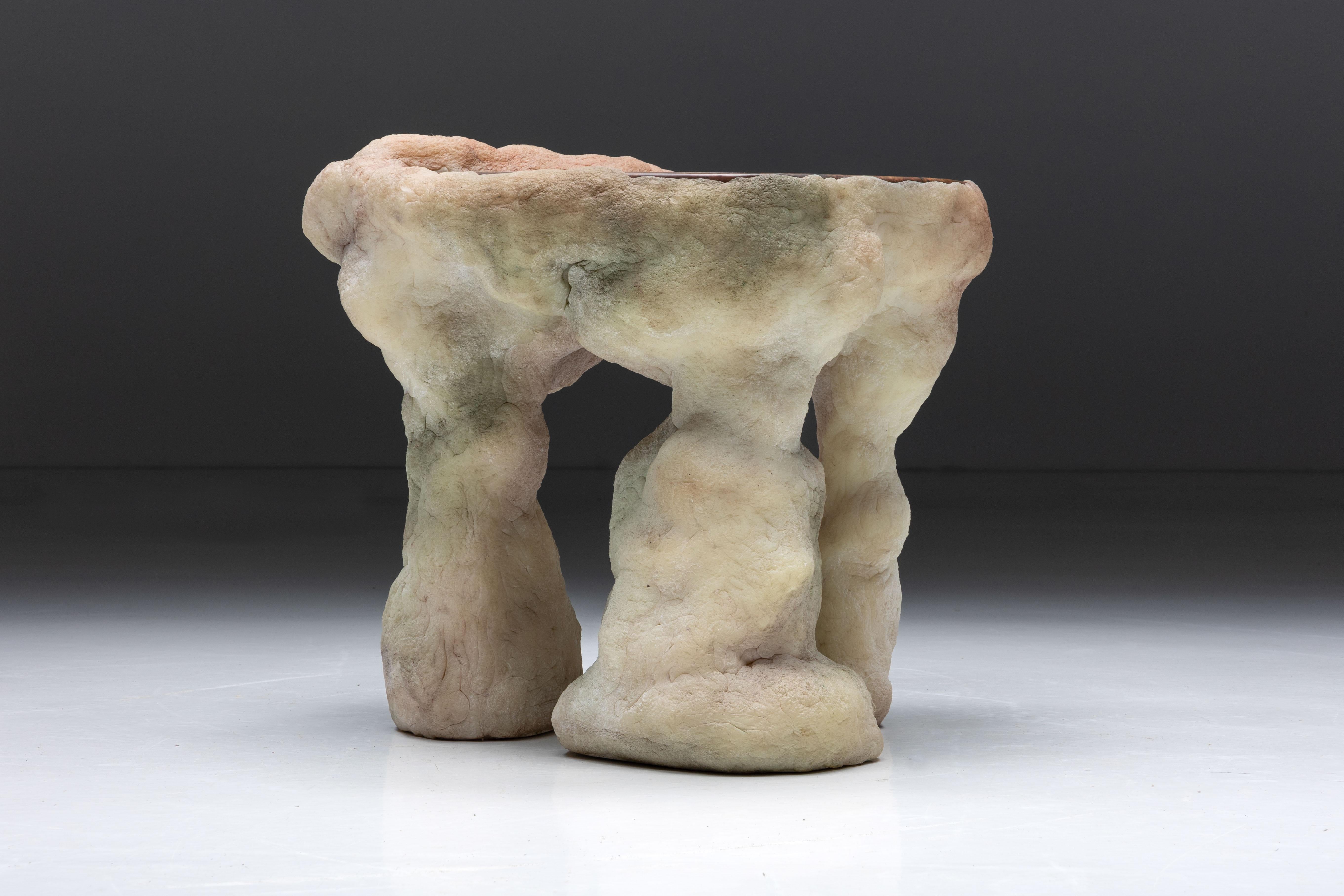 Elissa Lacoste's 'I Dream of Megalithic Times' series: Side Table, 2020. Composed of various speleothem-like shapes emerging from silicone skins infused with earthly pigments. This collection of functional art pieces challenges conventional notions