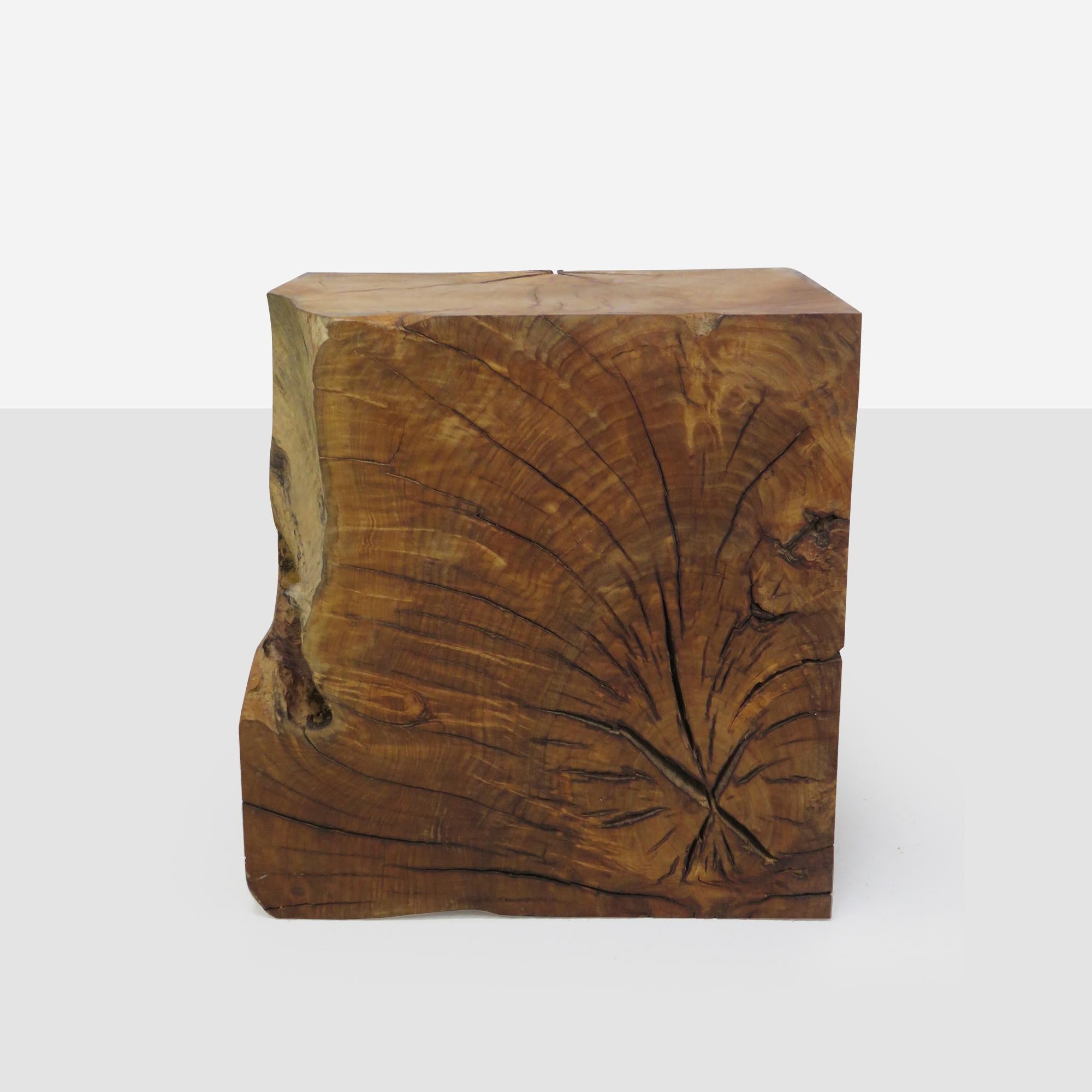 A unique side table of bay laurel with natural lines and a live edge side. 