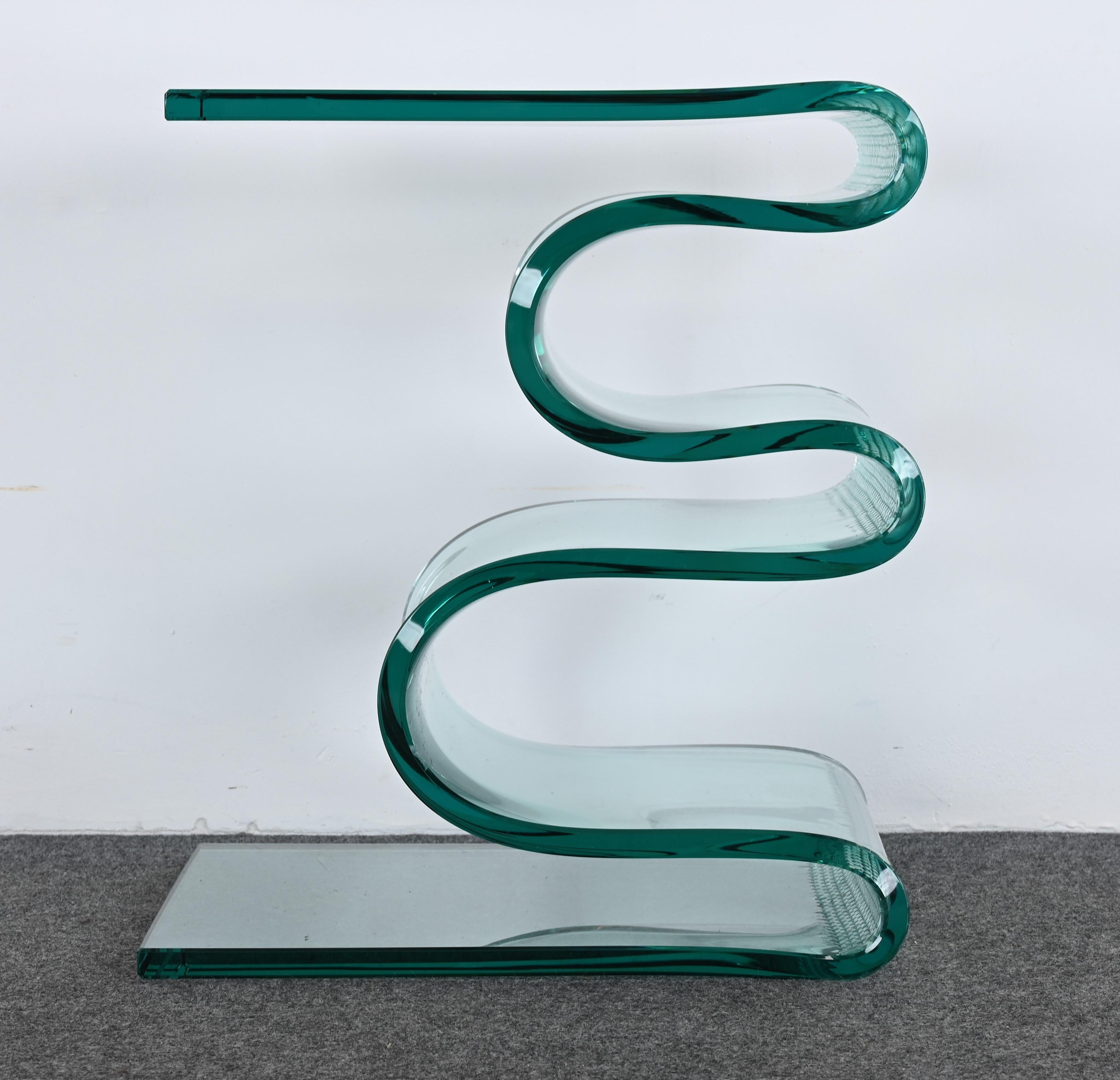 A fantastic handmade Zig Zag table designed by Laurel Fyfe. This handmade table was sold in galleries and retail stores across the United States. The unique side table was formed with steel cable while the glass was near a liquid state. This
