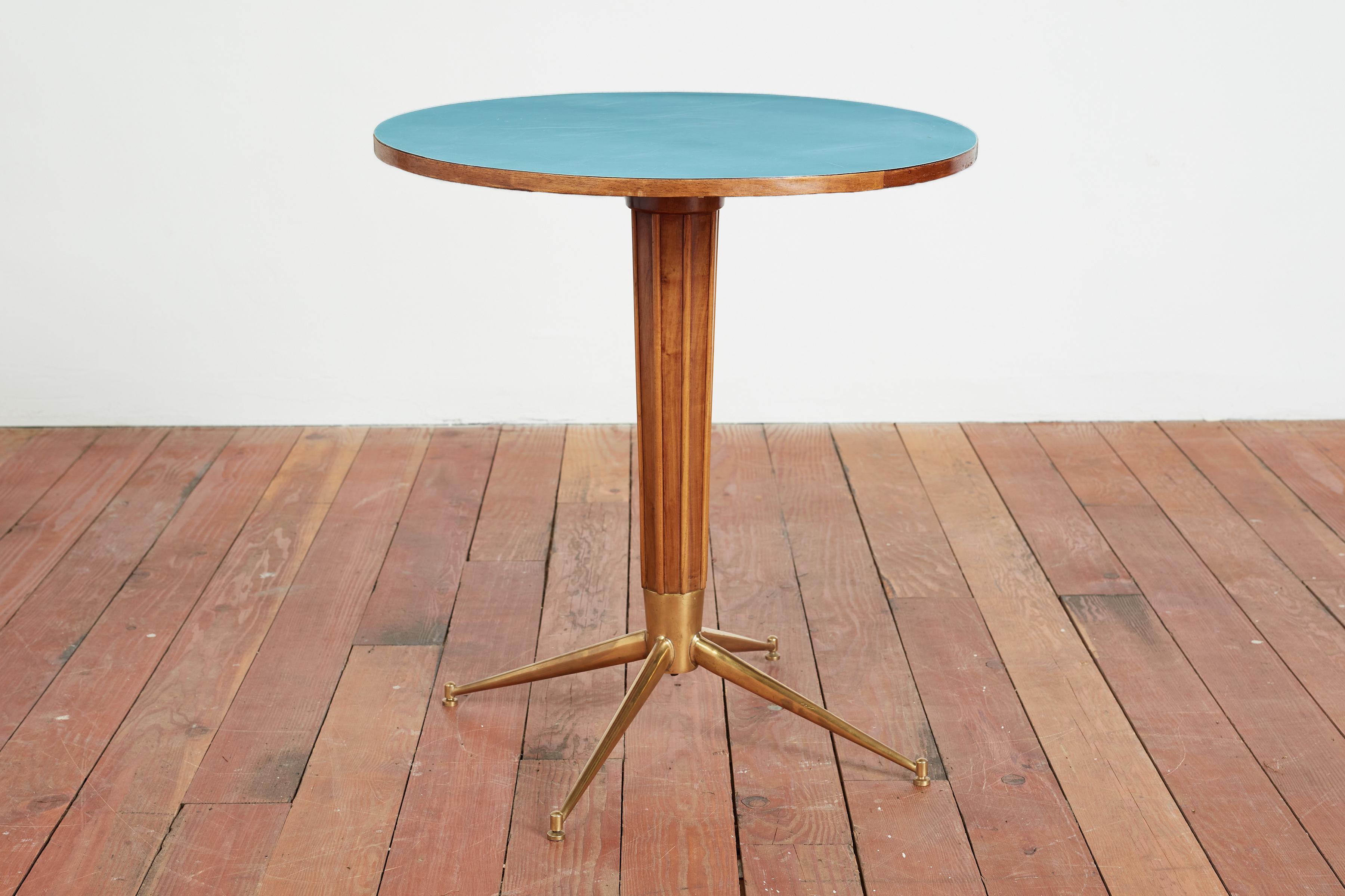 Wonderful pedestal table with fluted wood base, brass legs and original 