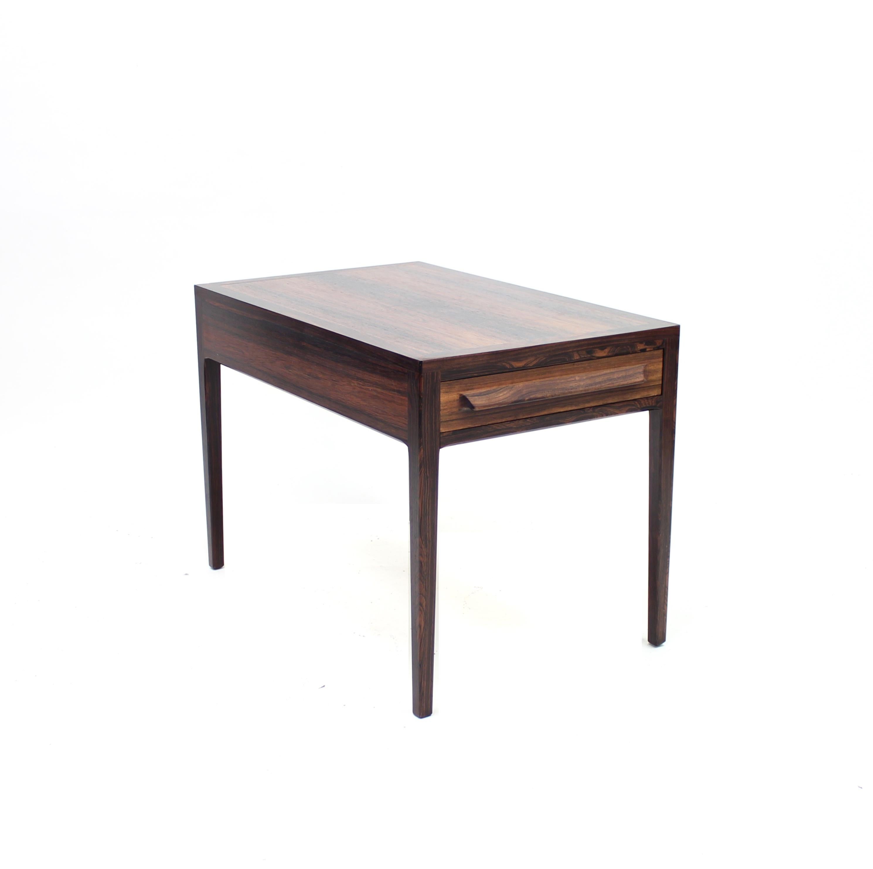 Rosewood side table from the 1960s by Norwegian manufacturer O.P. Rykken & Co. Front side with a drawer. Can also be used as a nightstand. Good vintage condition with normal ware consistent with age and use including a few scratches and marks. Tiny