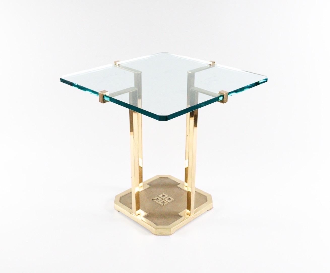 Peter Ghyczy, side table, model 'T-18', brass construction holding a solid glass top, 
Dimensions approx.: H. 50cm, W. 50cm, D. 50cm.