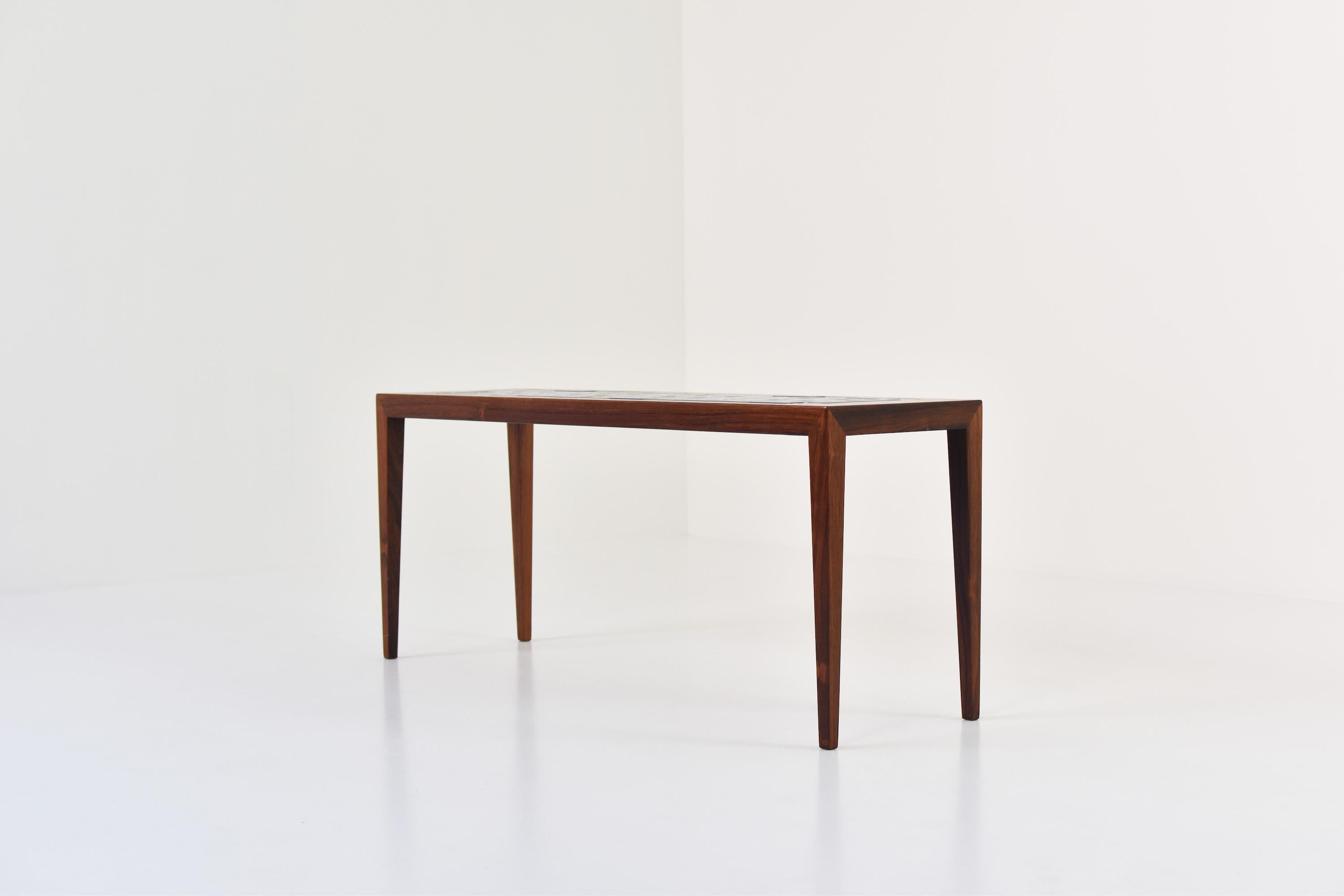 Side table by Severin Hansen for Haslev, Denmark, 1965. This table is made out of rosewood and has ceramic tiles in the top from the “Tenera” series by Nils Thorsson for Royal Copenhagen. Labeled. Clean lines. Mint condition!