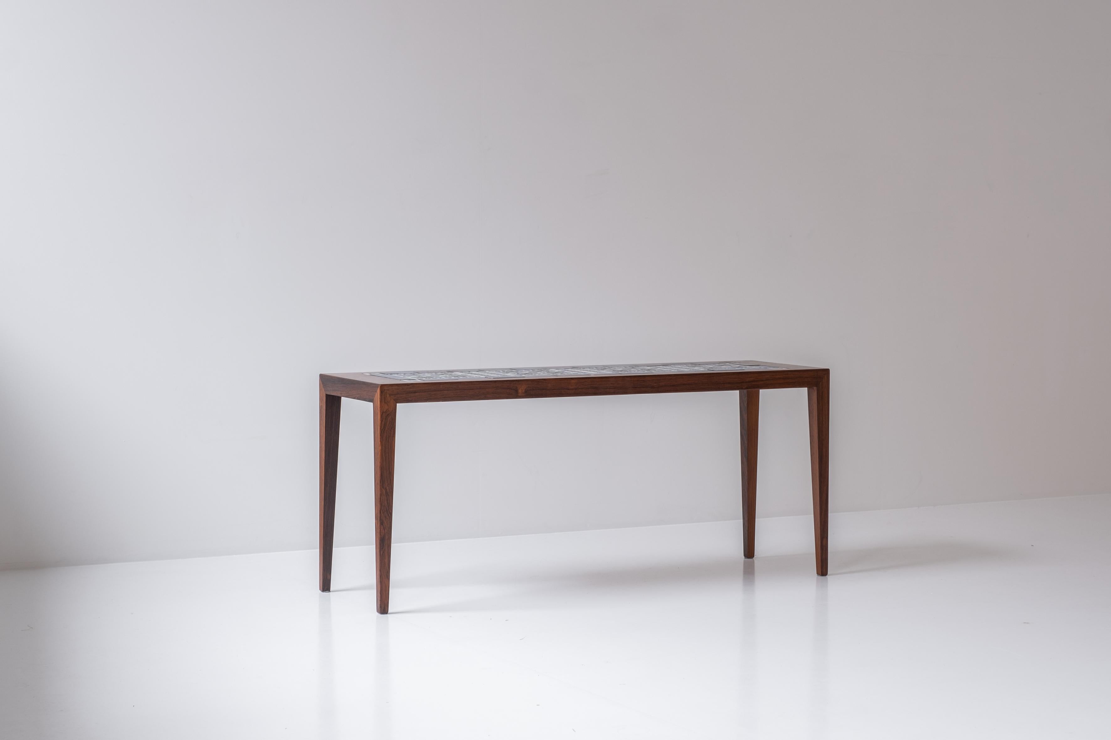 Side table by Severin Hansen for Haslev, Denmark, 1965. This table is made out of rosewood and has ceramic tiles in the top from the “Tenera” series by Nils Thorsson for Royal Copenhagen. Labeled. Clean lines. Mint condition!