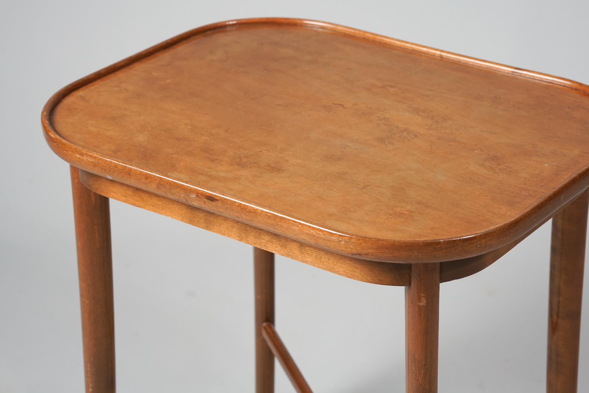 Side table, designed by Carl-Johan Boman, 1940s. Stained birch. Good vintage condition, patina consistent with age and use. Beautiful Scandinavian Modern design. 

Carl-Johan Boman was a Finnish furniture maker and one of Finland's first interior
