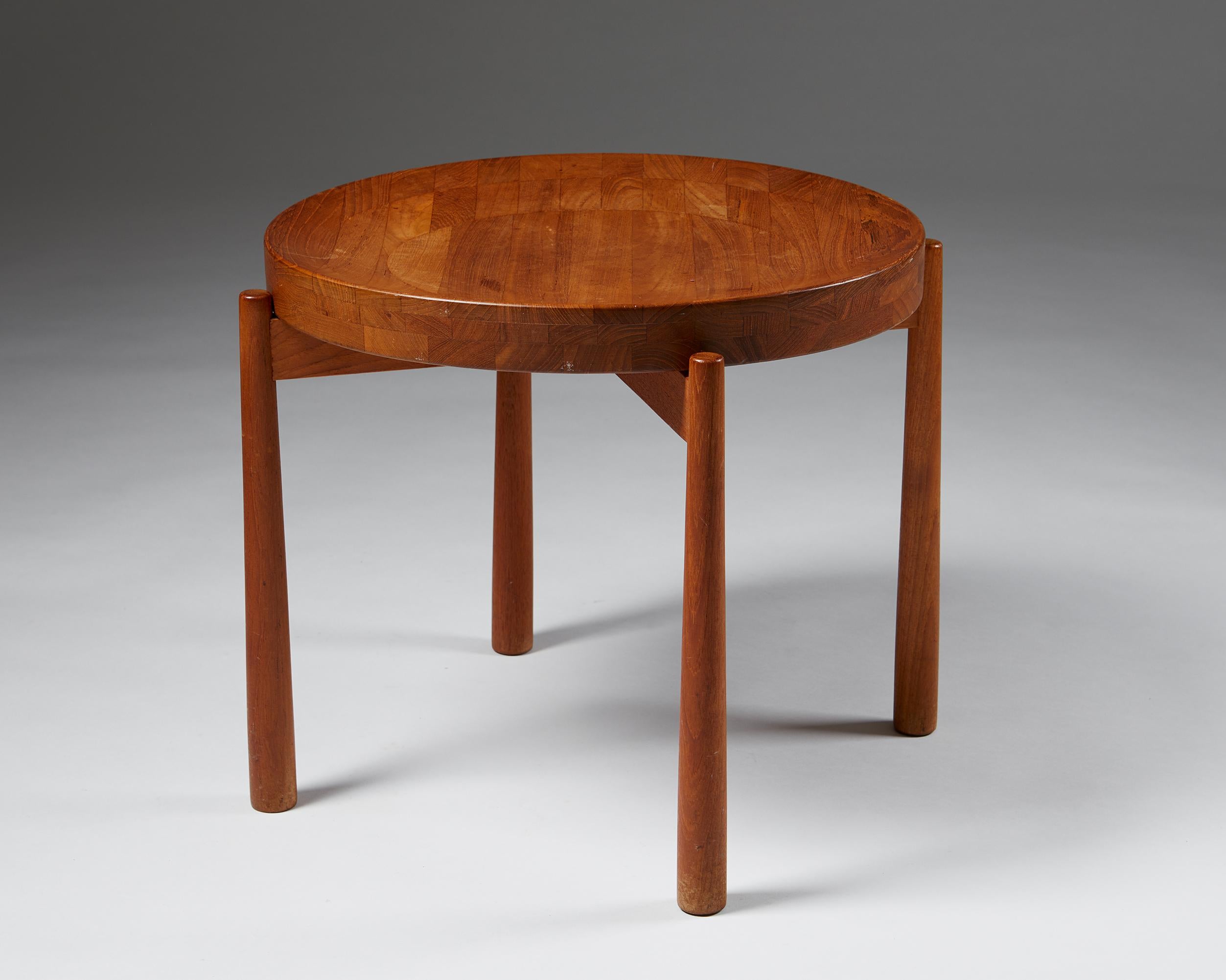 Side table designed by Jens Harald Quistgaard,
Denmark, 1950s

Teak. 

Dimensions
H: 44 cm / 17 ¼’’
W: 49.5 cm / 19 ½’’
D: 49.5 cm / 19 ½’’.
 
Exquisite woodwork and a beautifully shaped, removable tray surface that can function as a bowl