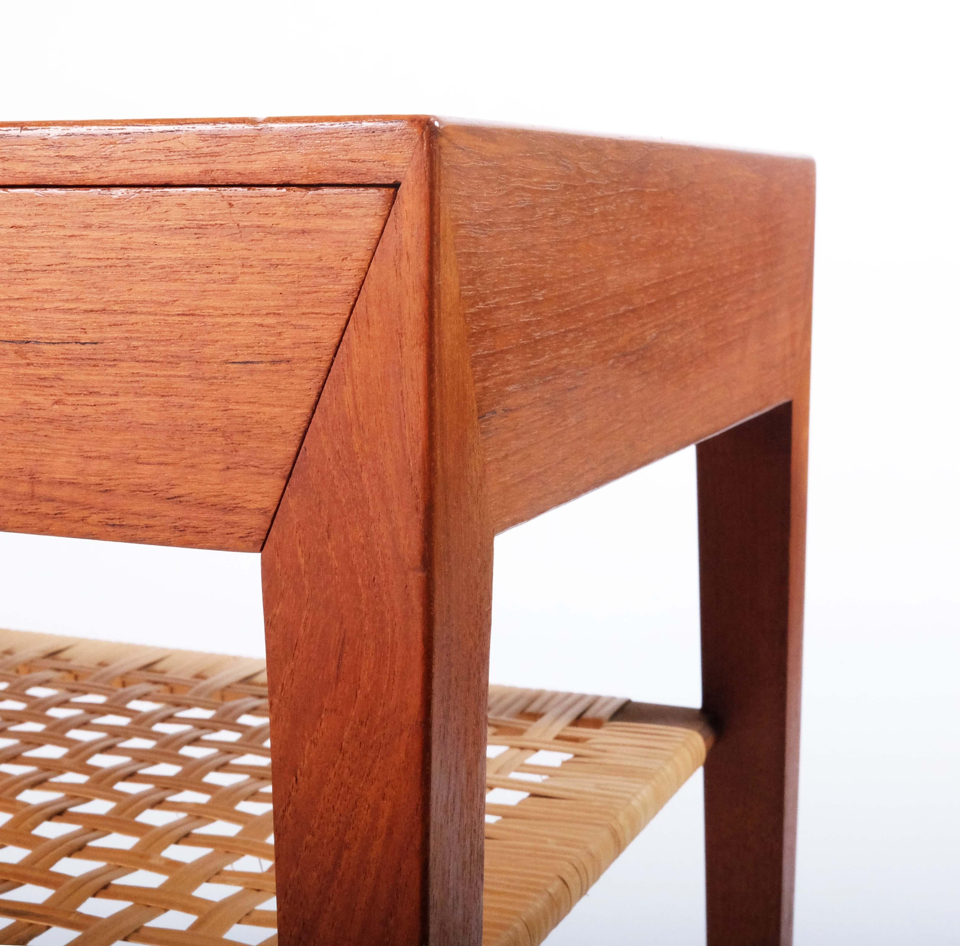 The furniture factory Haslev Møbelsnedkeri had it's own very distinct style developed by their chief designer Severin Hansen. This small side table in teak and cane is a very good example of that style.