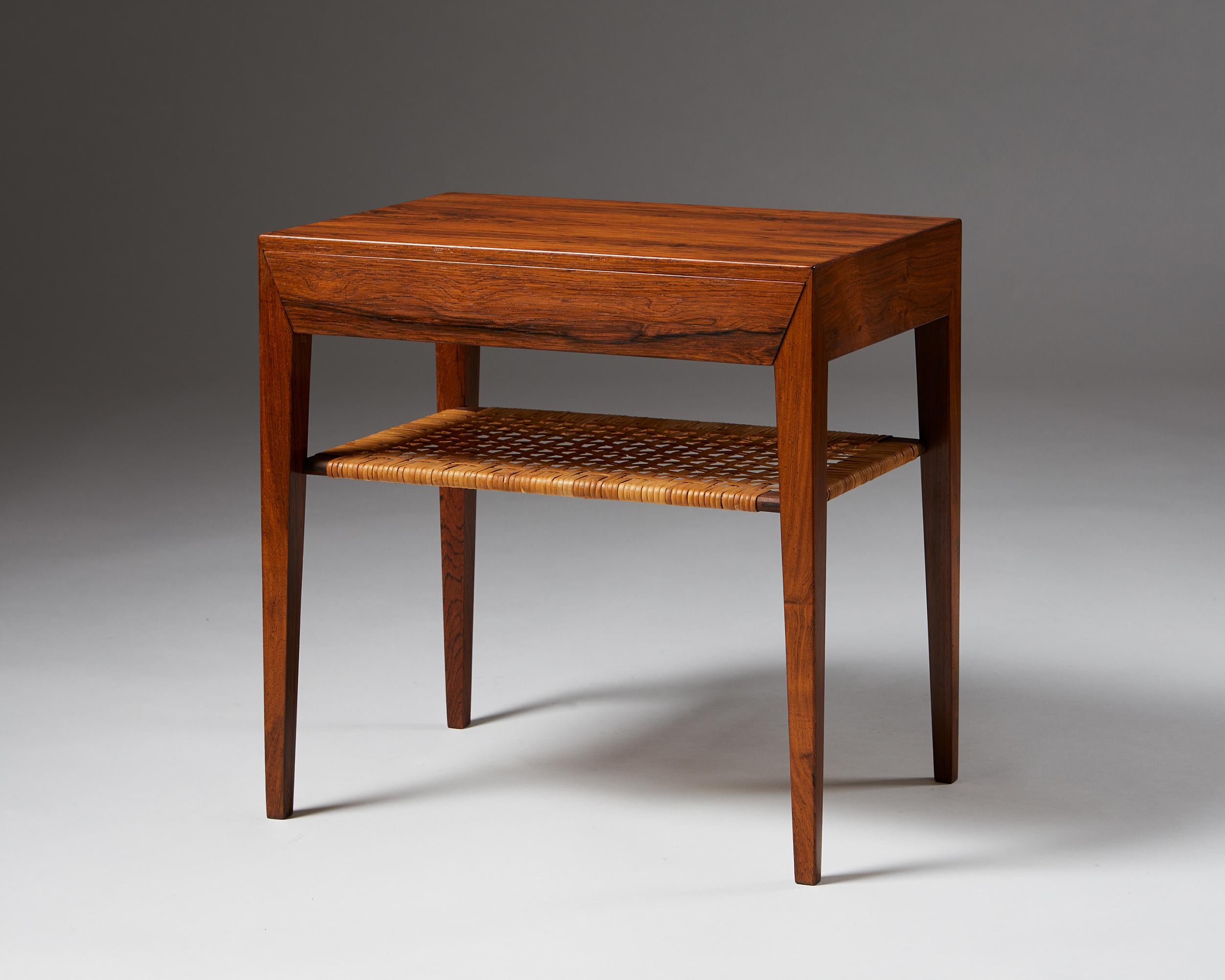 Rosewood with cane shelf.

Measures: H 50 cm/ 1' 7 3/4