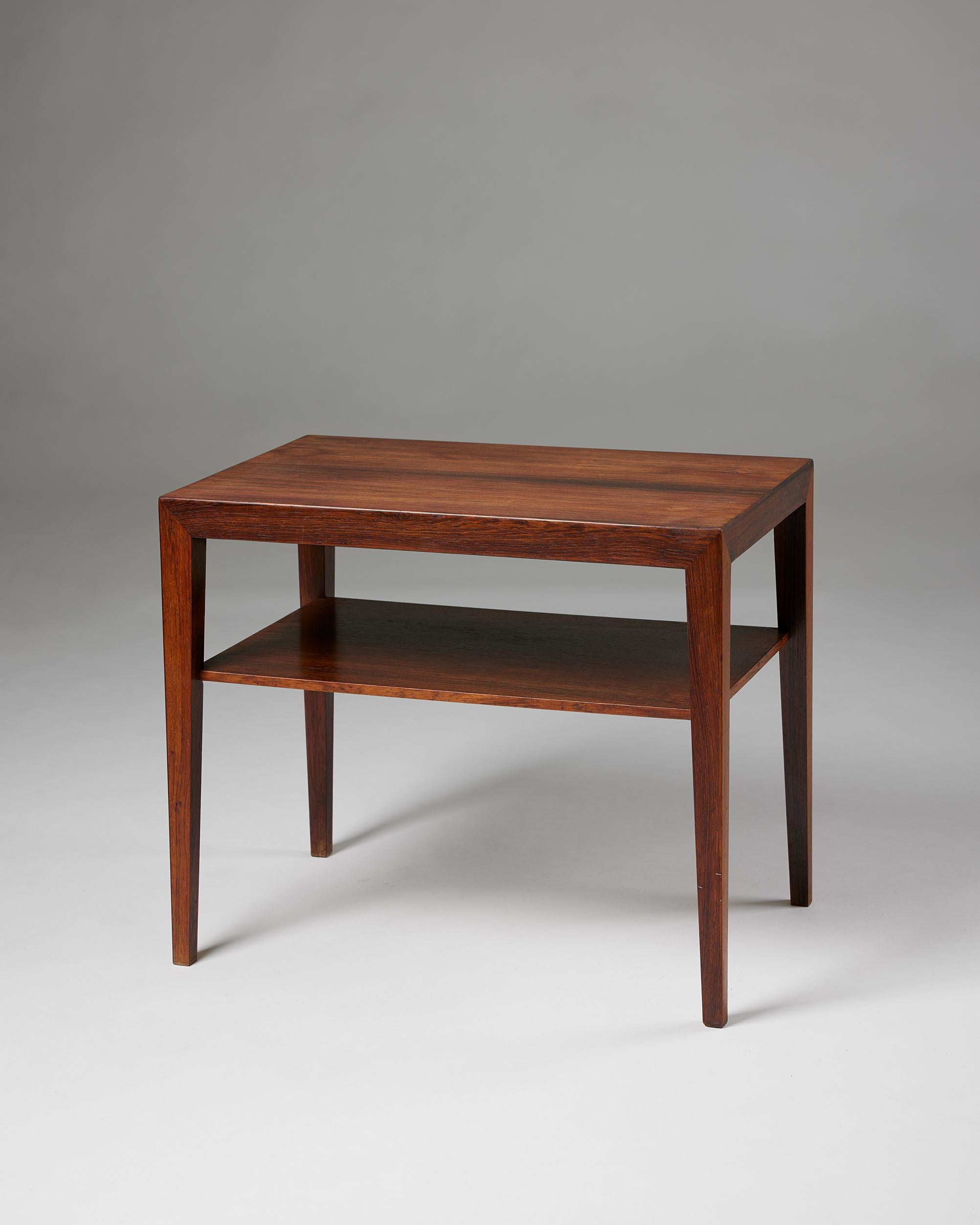 Side table designed by Severin Hansen Jr,
Denmark, 1960s.

Rosewood.

Stamped.

H: 48 cm / 19''
W: 57 cm / 22 1/2''
D: 37 cm / 14 3/4''