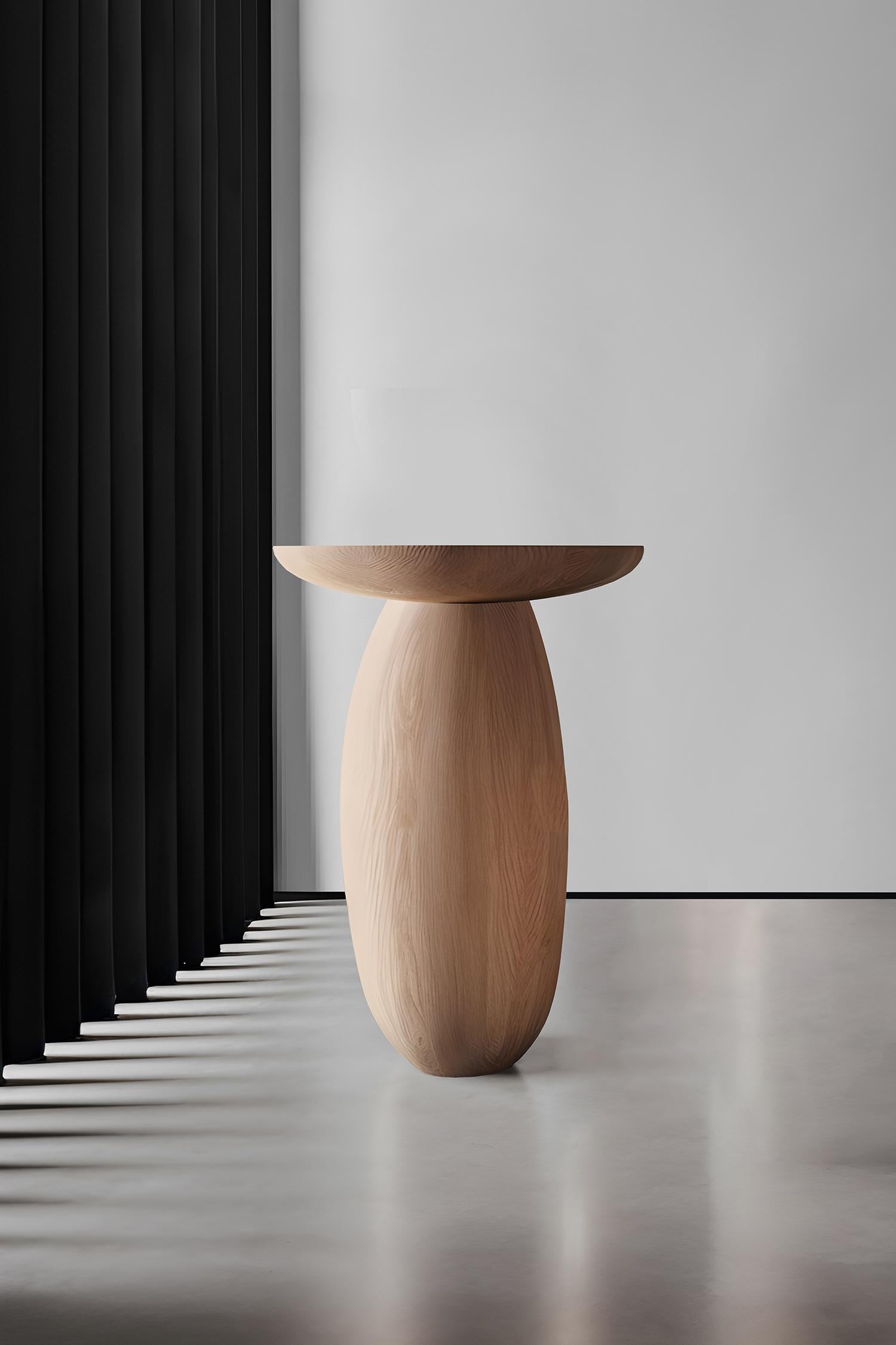 Introducing the Samu Collection by NONO, where simplicity meets elegance in the form of sculptural stools, side tables, and plinths. Each piece in this collection boasts a gently domed and smooth circular top, paired with a uniquely shaped base.