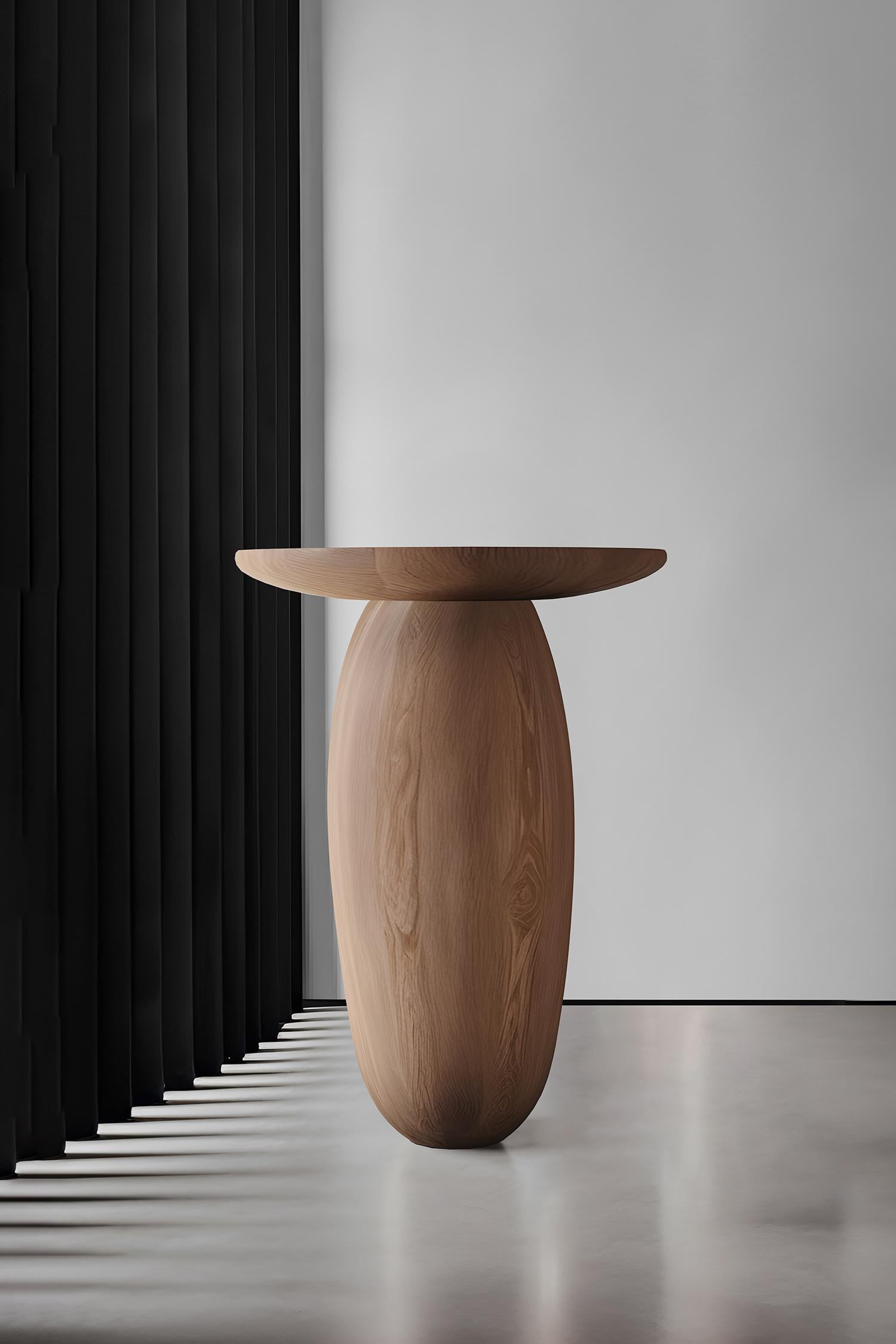Introducing the Samu Collection by NONO, where simplicity meets elegance in the form of sculptural stools, side tables, and plinths. Each piece in this collection boasts a gently domed and smooth circular top, paired with a uniquely shaped base.