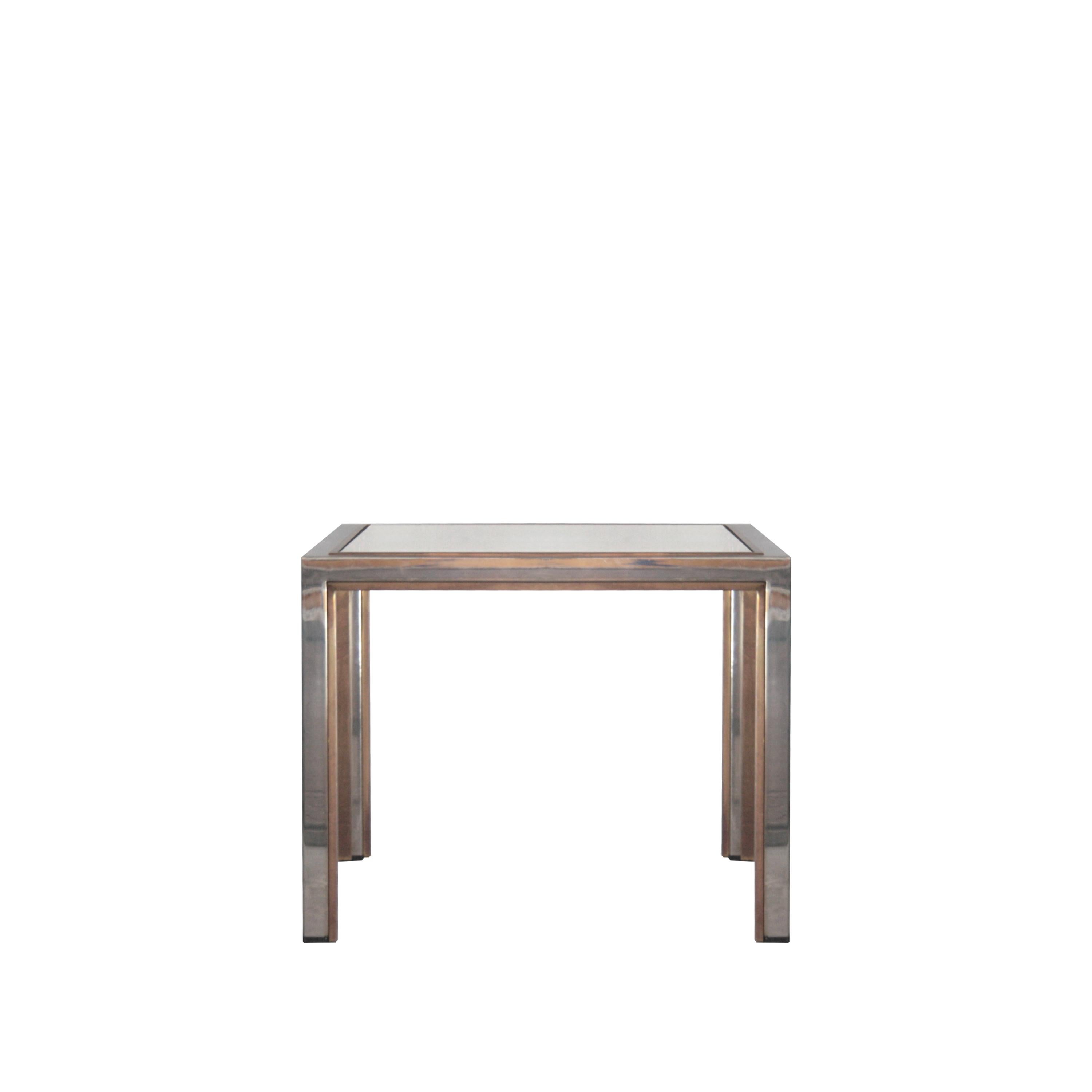 Side table with chromed steel and brass structure. Smoked glass envelope.