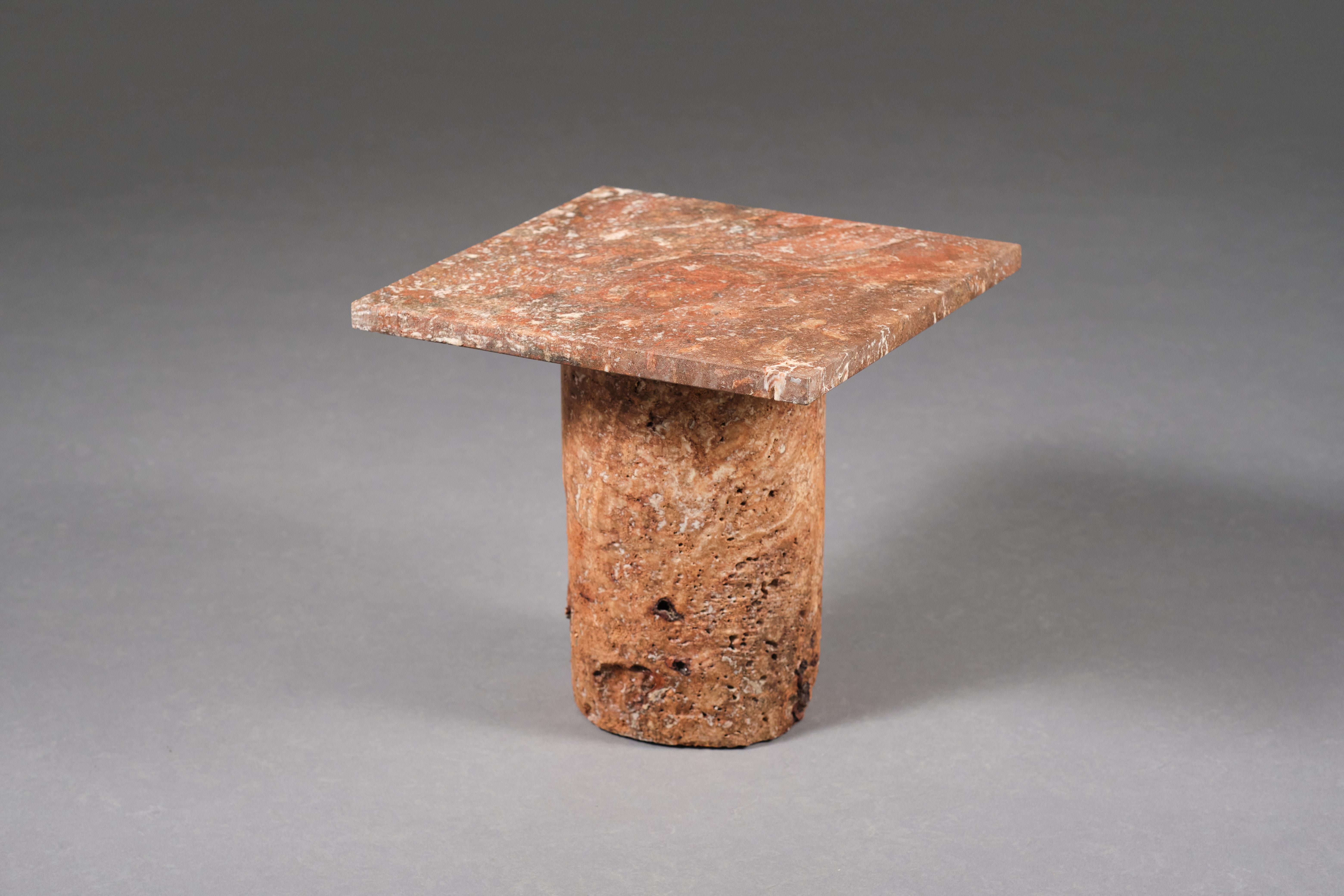 Handcrafted from rusty red travertine, Coral is a one-of-a-kind sculptural side table designed by Josep Vila Capdevila. The designer subjected the natural stone to a sulfuric acid treatment—a process that dissolves the organic content and exposes
