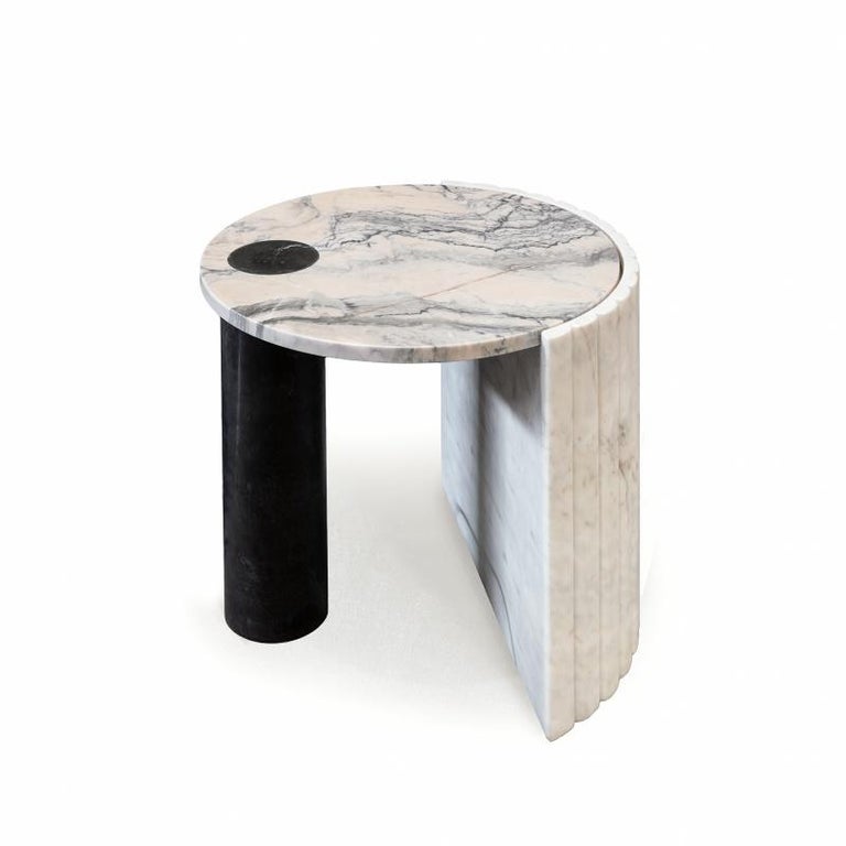 Helene side table is unique in its conception. The combination of different marbles like Estremoz marble, Nero Marquina and Estremoz pink marble makes this piece a sign of unconformity and originality. Made to order. 
