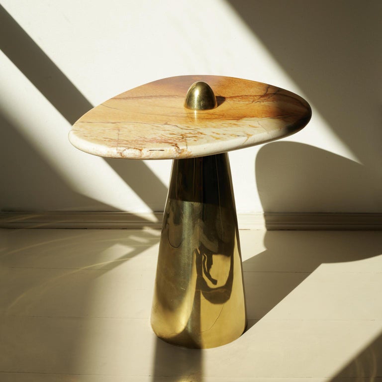 Produced in São Paulo, Brazil.

This side table in cast brass and Patagônia Stone was meticulously handmade by master artisans one piece at a time. It is therefore quite difficult, if not impossible to make identical items. The Patagônia Stone have