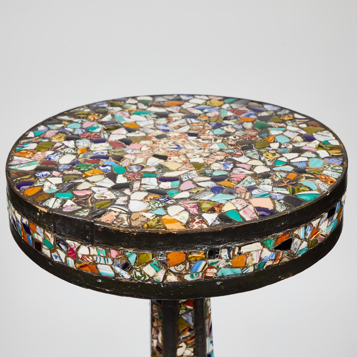 A side table in chard pieces of pottery, originating in France, circa 1910.