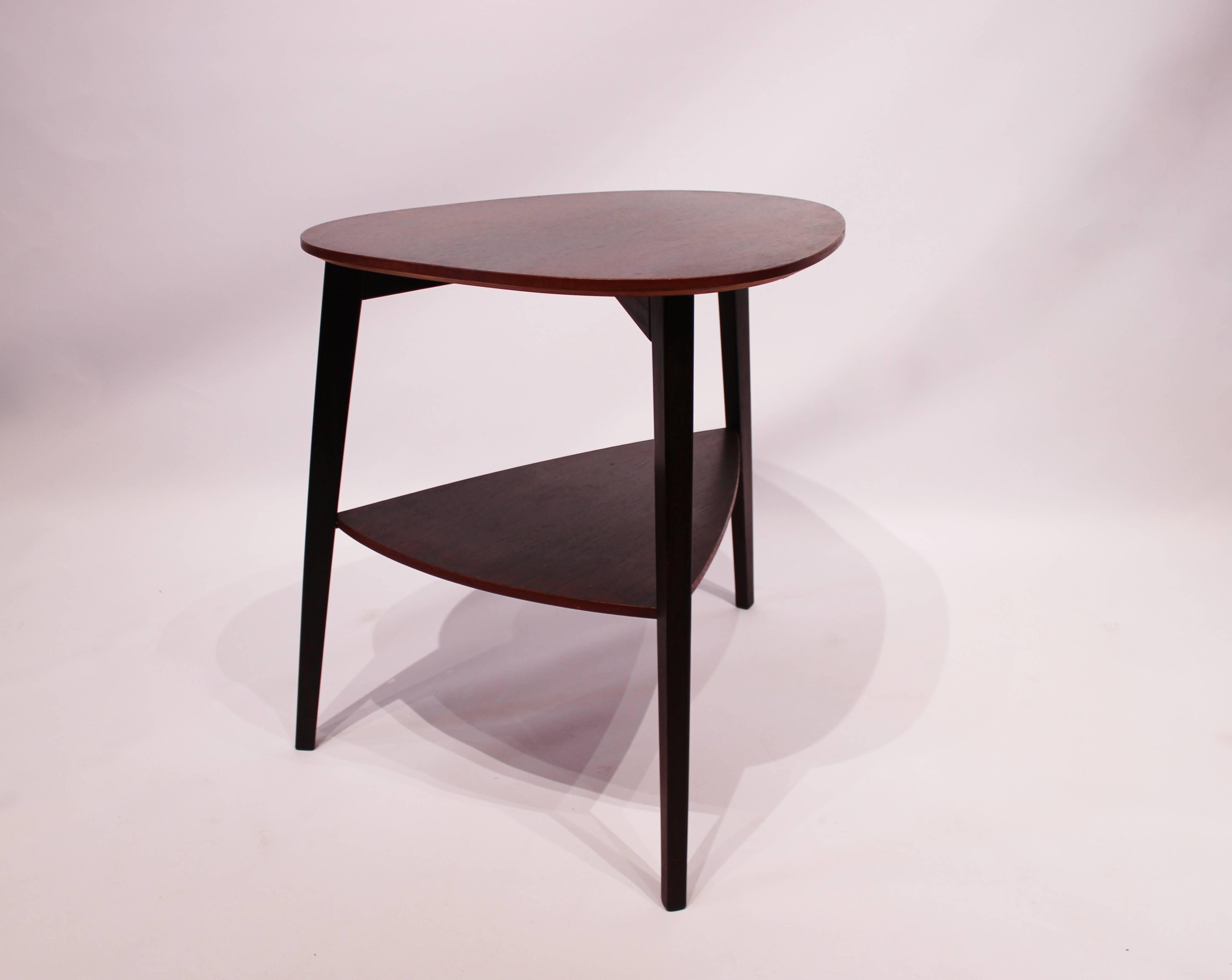 Side table in dark wood of beautiful Danish design from the 1960s. The table is in great vintage condition.
