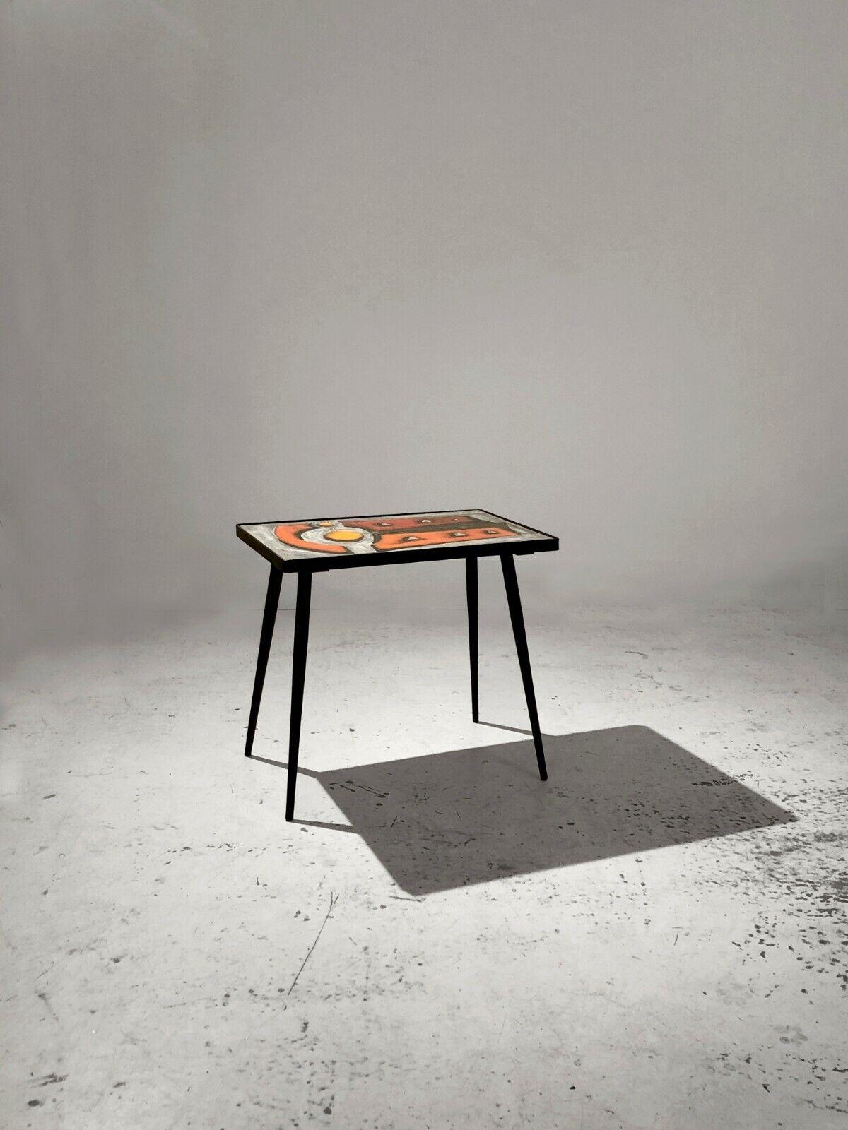 A small coffee table or a side table or a headboard, Modernist, Geometrical Abstraction, Lyrical Abstraction, Forme-Libre; dynamic structure in wrought iron, with a pictorial top in enameled lava stone depicting an abstract scenery made with light