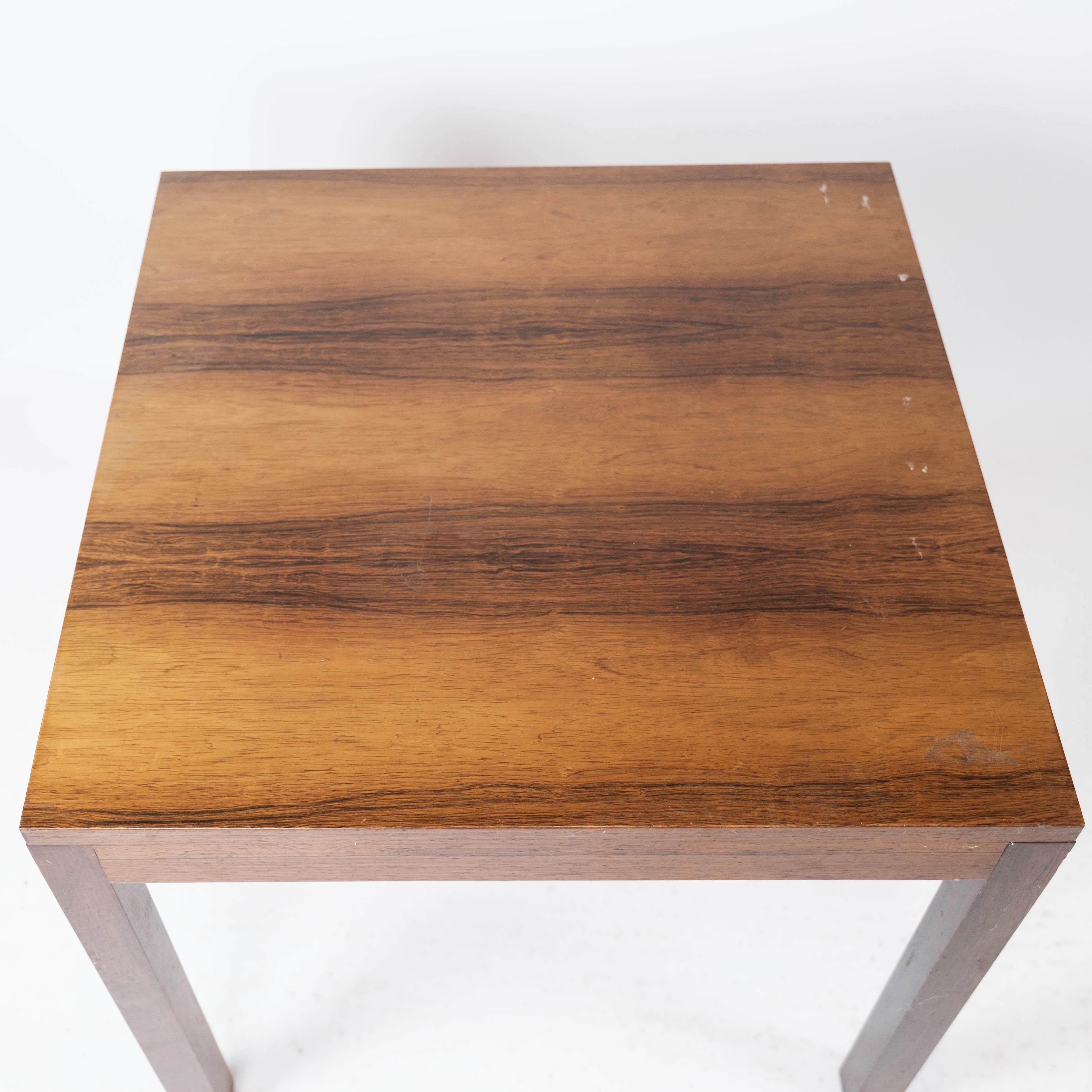 Side table in rosewood of Danish design from the 1960s. The table is in great vintage condition.