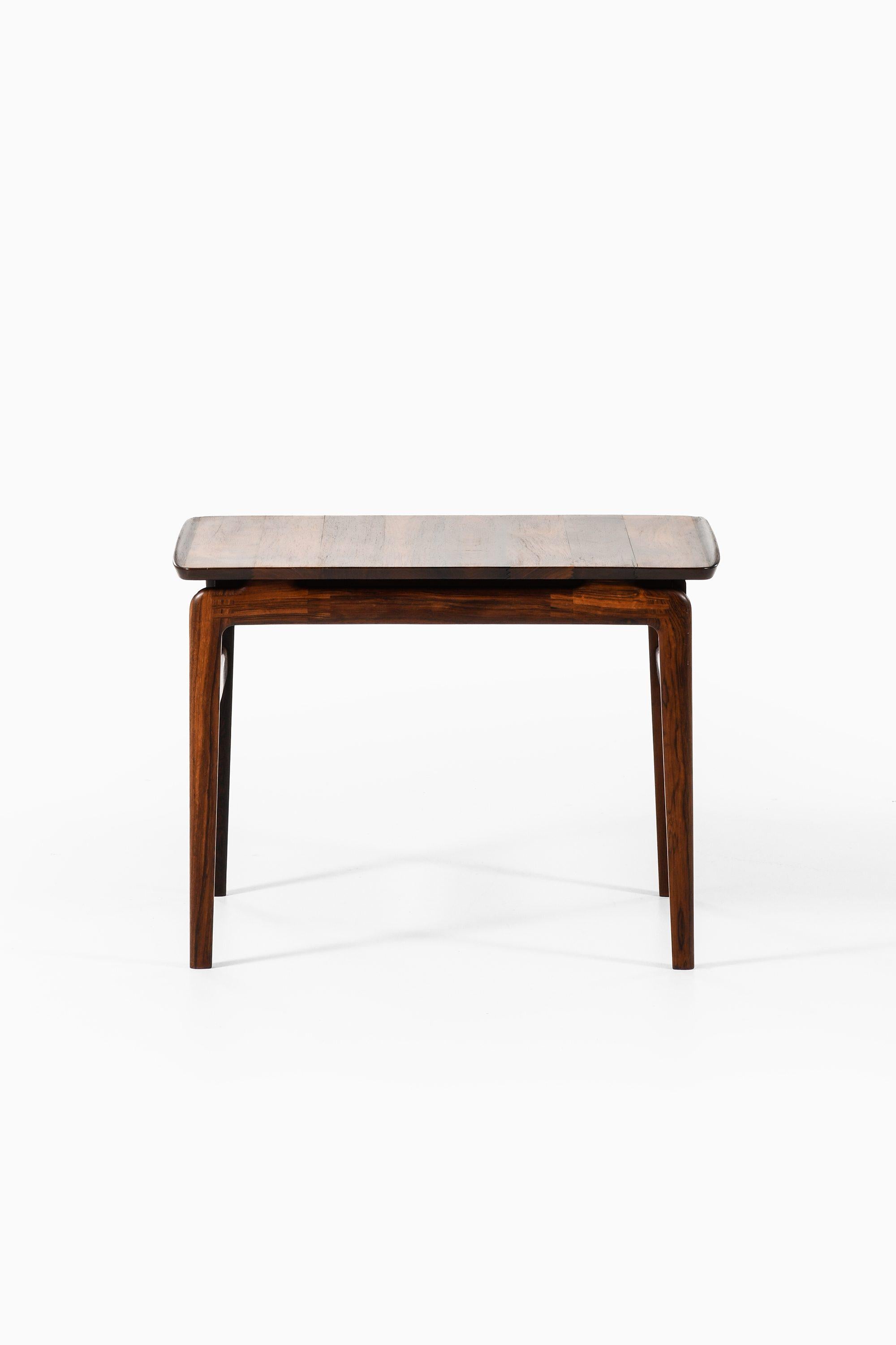 Side Table in Solid Rosewood by Peter Hvidt and Orla Mølgaard-Nielsen, 1960's

Additional Information:
Material: Solid rosewood
Style: Mid century, Scandinavia
Produced by France & Son in Denmark
Dimensions (W x D x H): 75 x 50 x 54