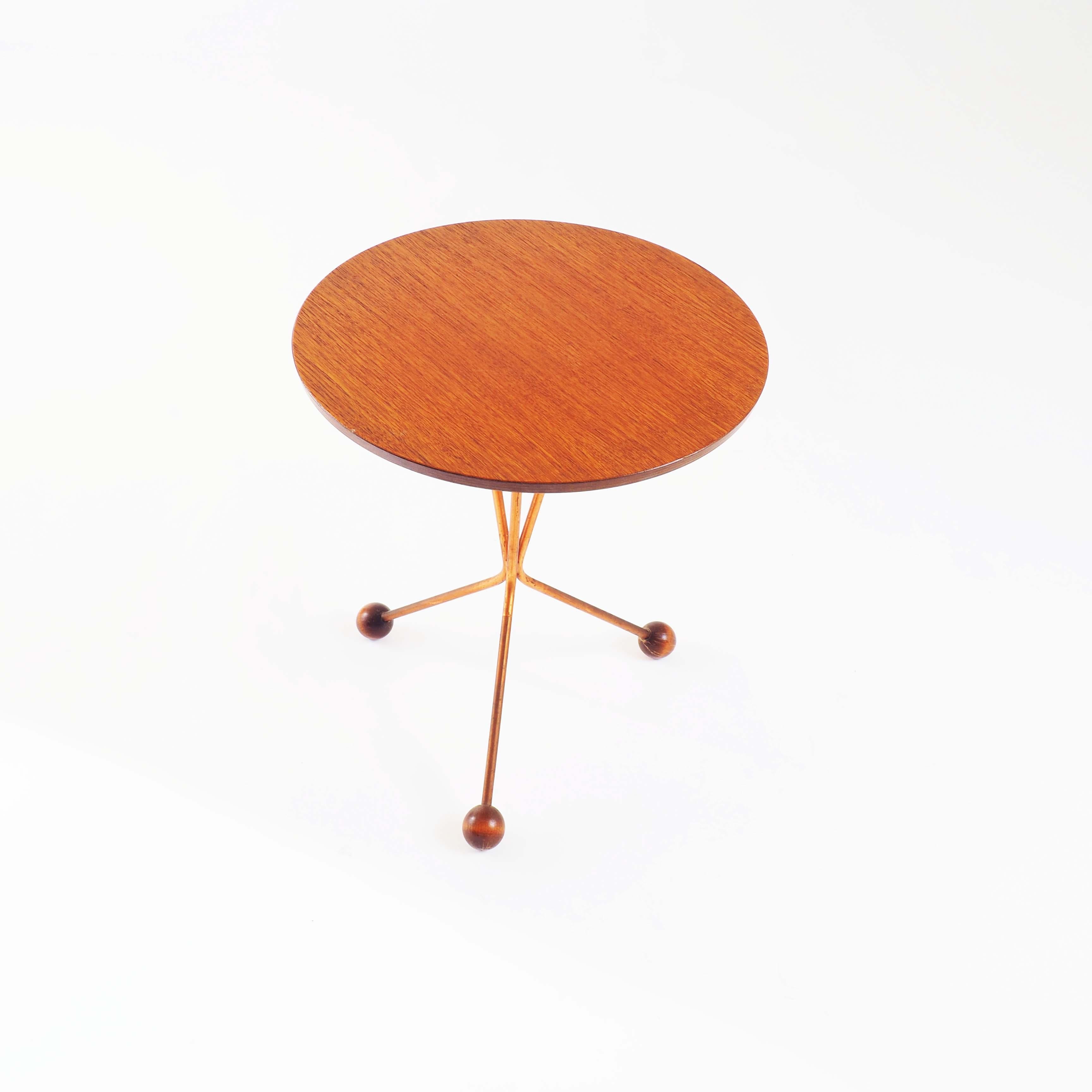 Side table by Alberts, Sweden. Designed by Albert Larsson.
With tabletop in teak and atomic wood-tipped legs in copper.