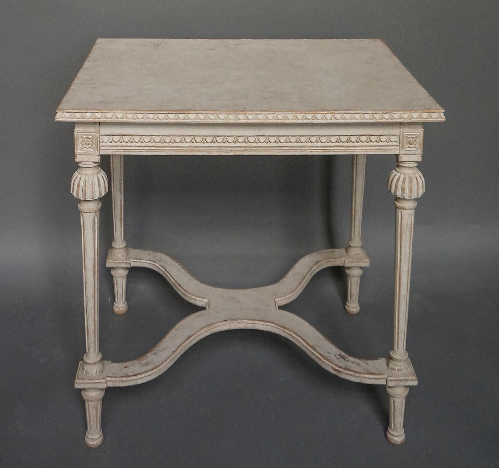 Small console or side table, Sweden, circa 1910, in the Gustavian Style. Lamb’s tongue molding around the top and the apron, tapering legs and saltier stretcher.