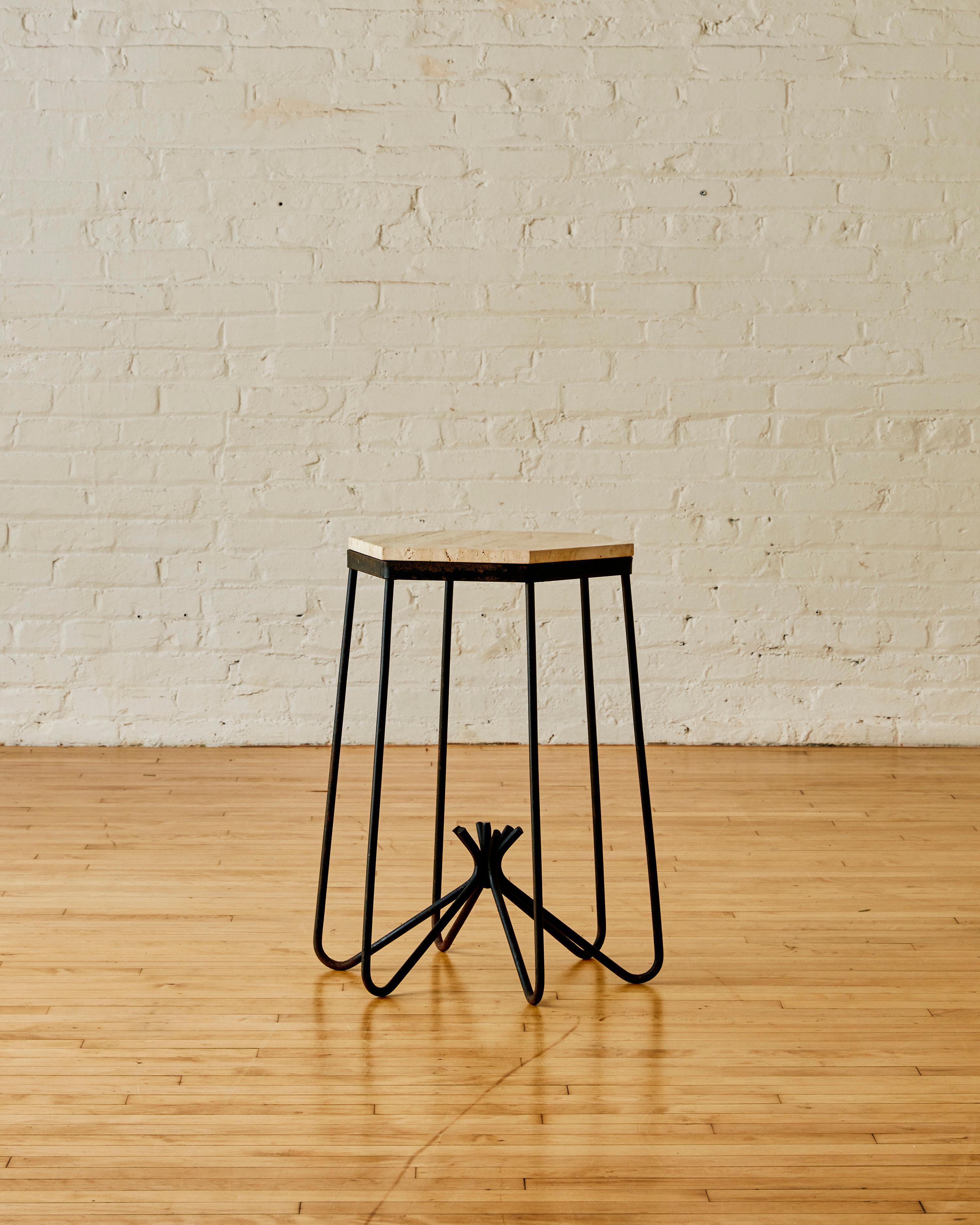 Side table in the manner of Jean Royere C. 1955 with detachable travertine tabletop and iron legs.

