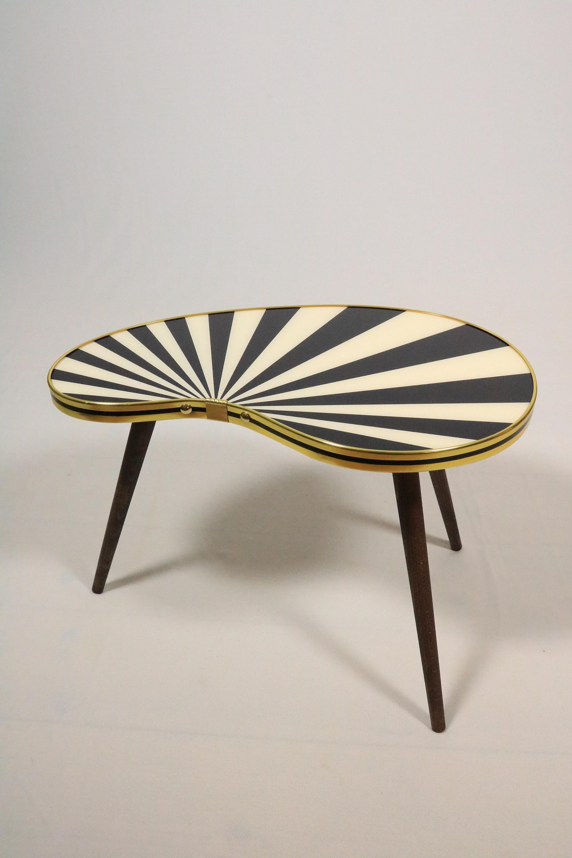 Exclusive offer of one small kidney shaped side table. 
Very decorative in black-white colored stripes (see other offers: optional in 4 different colours and patterns avaiable).

These tables are a high-quality new production after original models