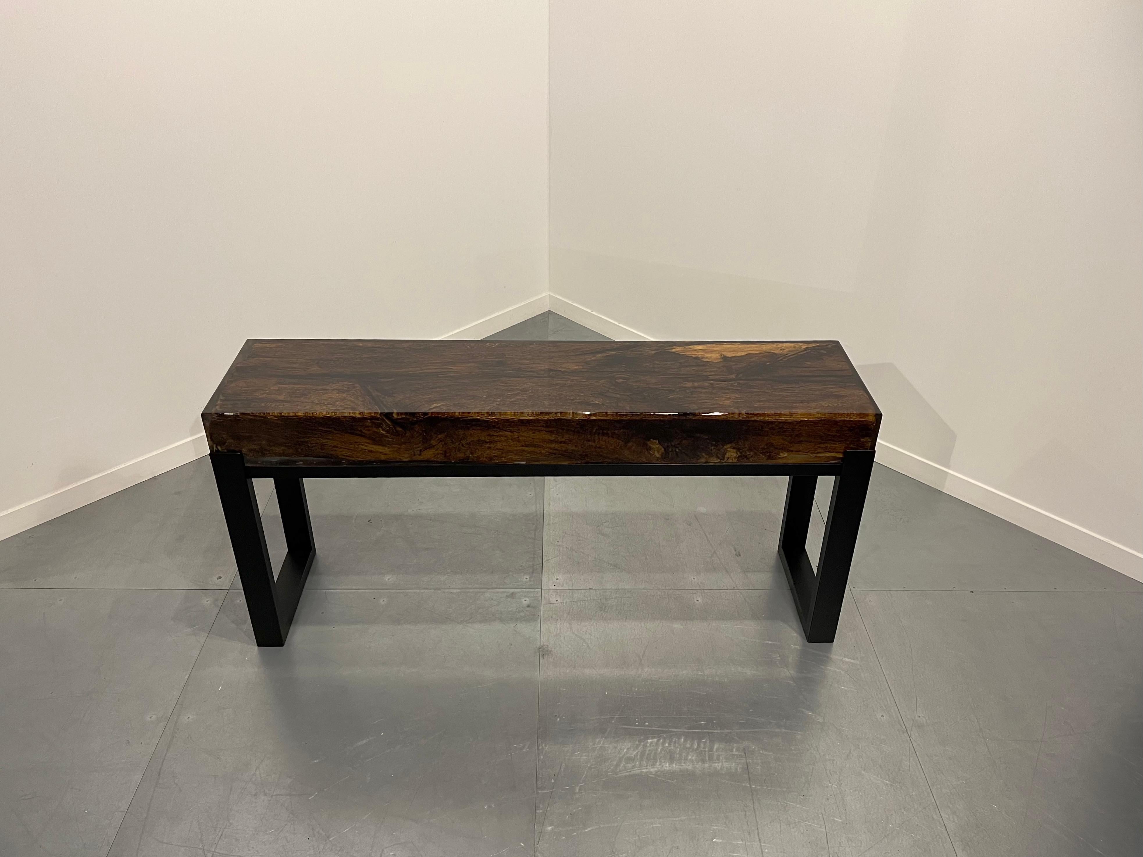 This Sidetable is made of an old oak wood beam which we coated in epoxy. The finish of the table is of the highest quality combined with the steel base.
This epoxy Sidetable is a definite eye catcher to your interior. And because of the age of the