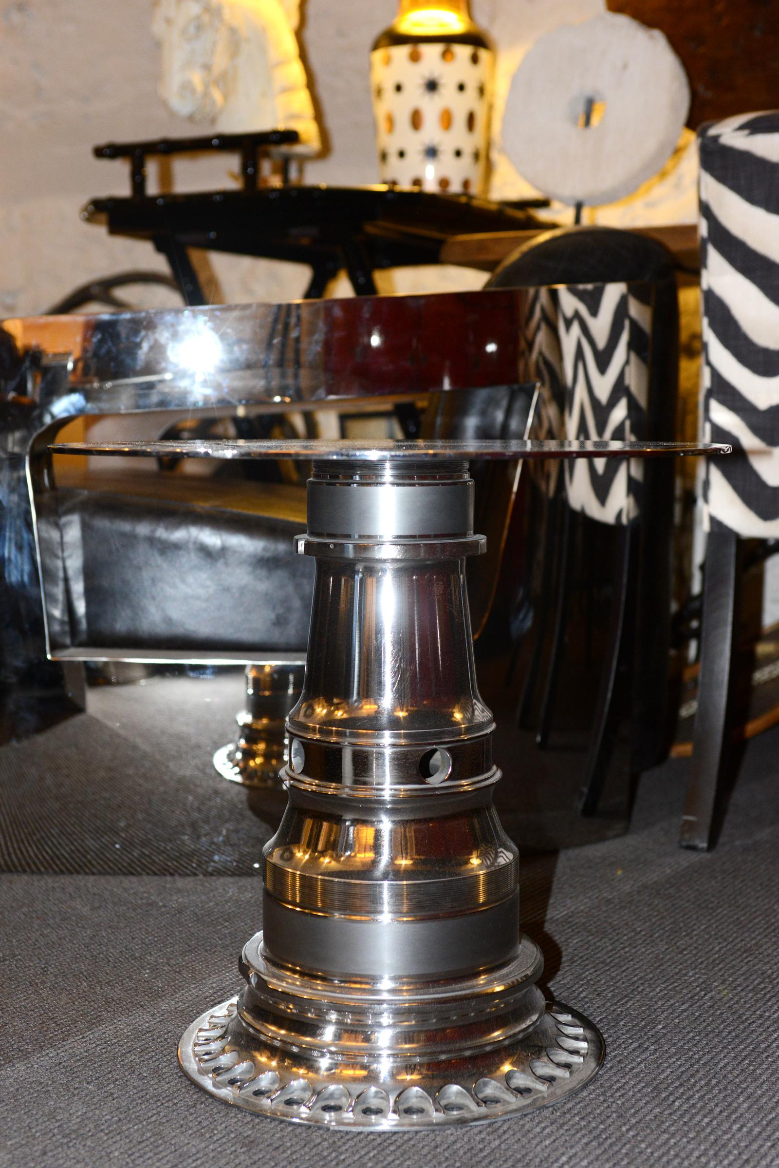 Side table made with a Boeing 747 gearing engine 
All in stainless steel, aluminium and nickel alloy called:
Titanium in chrome polished finish. Rare piece.
   