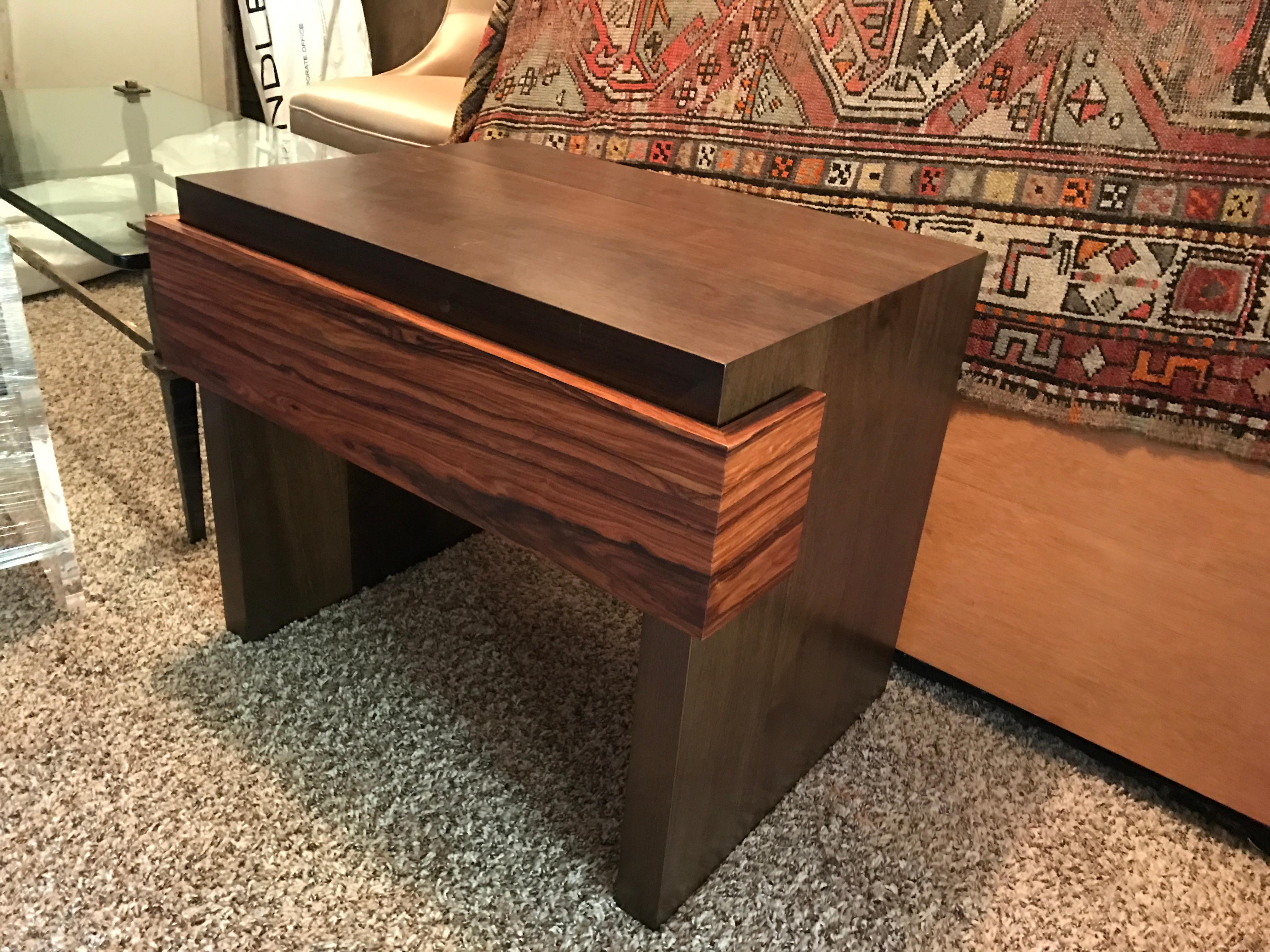 Reminiscent of the mid-century period, this elegant side table is handcrafted with traditional joinery. The unique mechanism of the drawer and the mix of exotic woods makes each piece unique. Each piece is stamped. Custom sizes and finishes