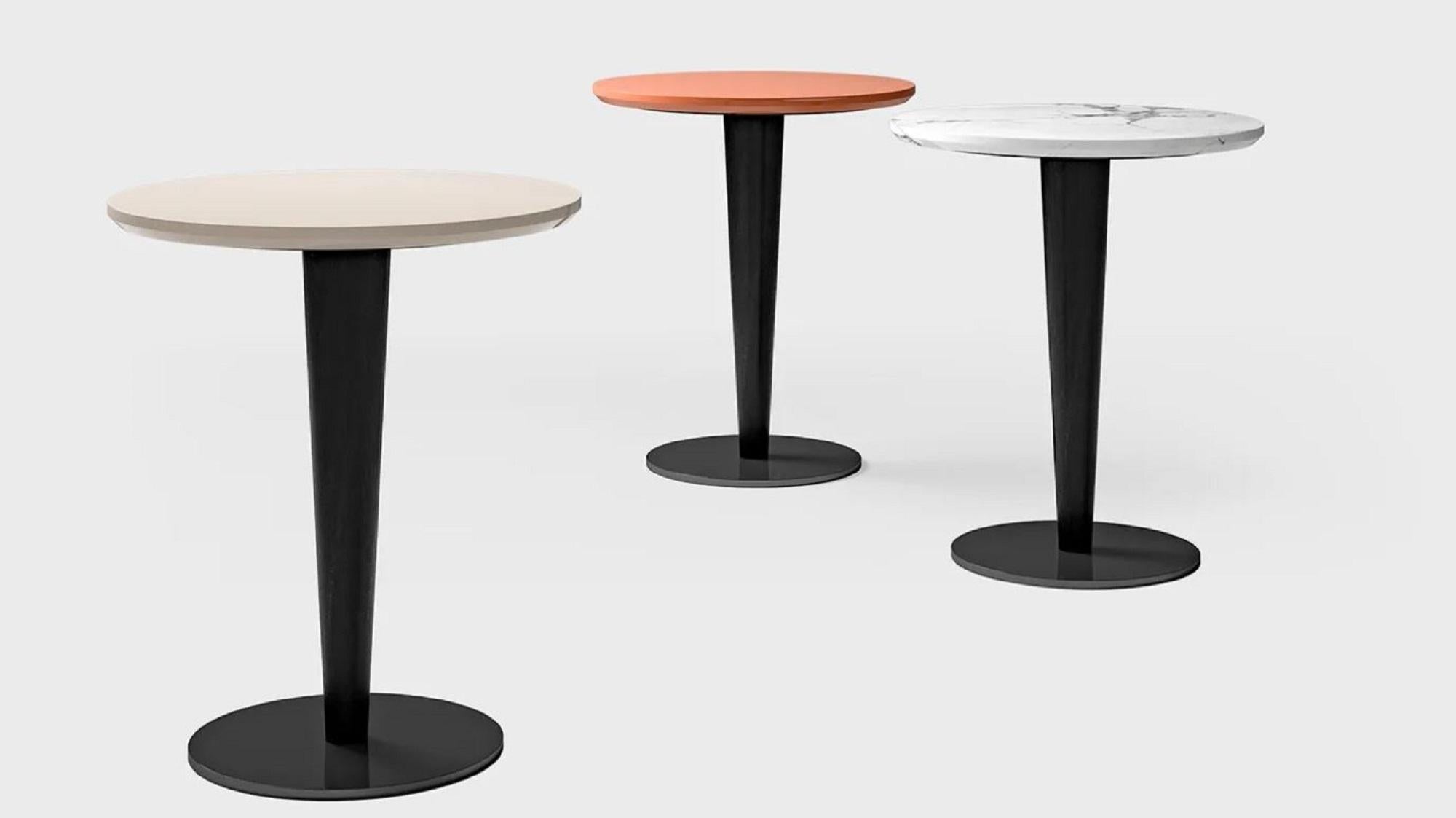 The Next Level Side Table from Malerba's Next Level collection is both elegant and functional. It features a top made of marble or wood, supported by matte black lacquered wooden legs with metal feet. This side table is perfect placed next to sofas