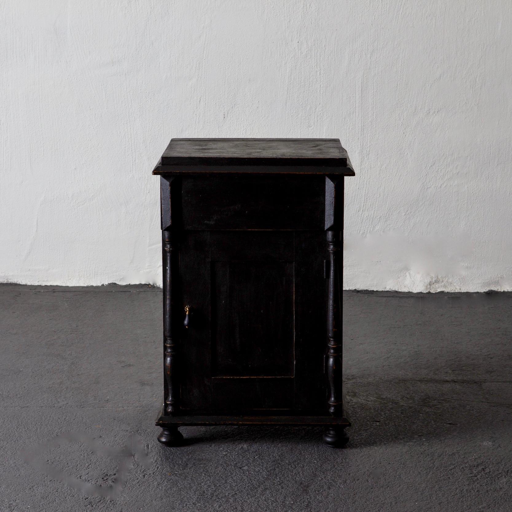 Side table nightstand Swedish black 19th century, Sweden. A nightstand made during the late part of 19th century in Sweden. Painted in our laserow black with contemporary hardware.
 