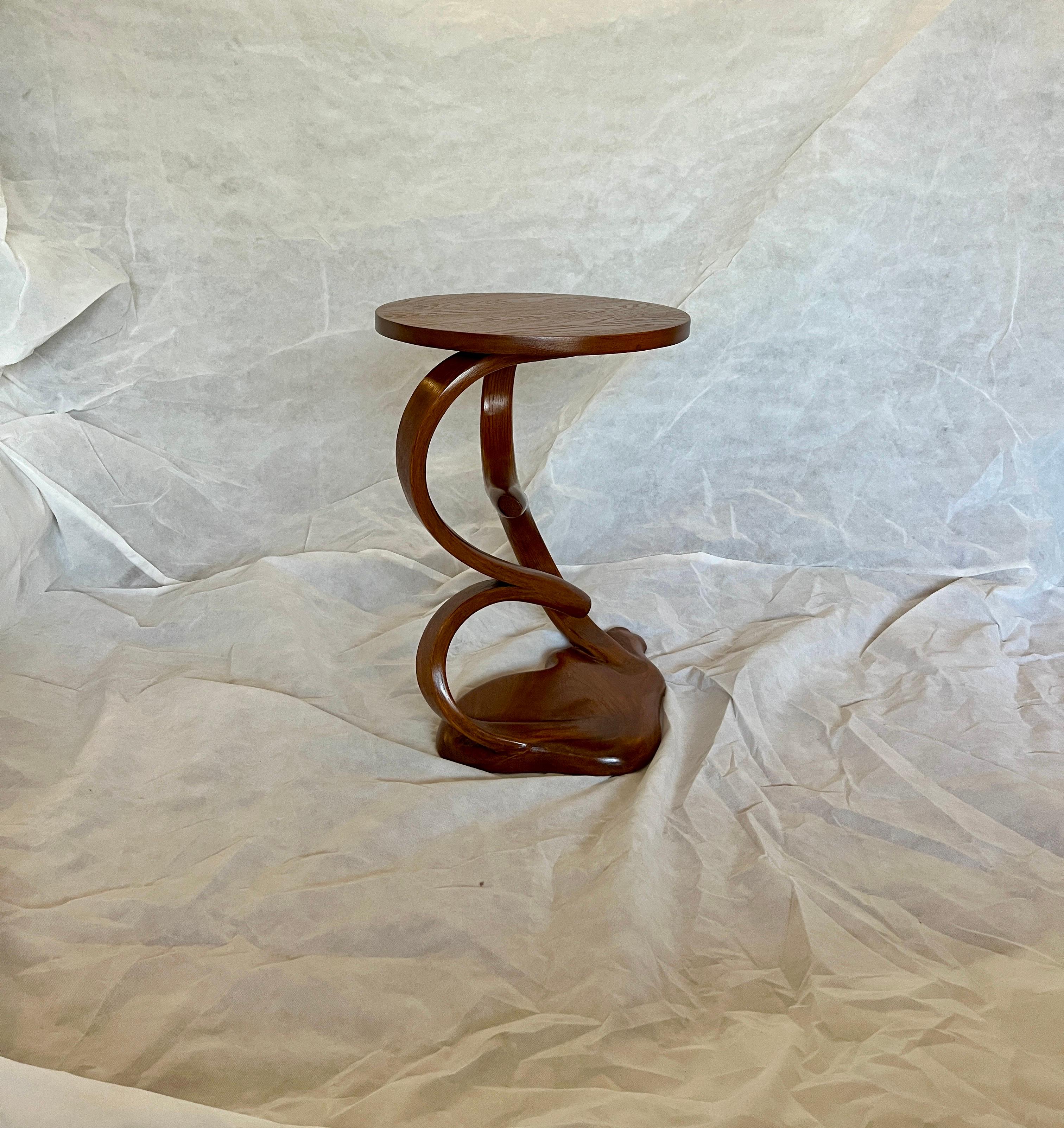 This piece's main element is bentwood's organic motion between the top and the base. The proportions of the top and the base are made to enhance the centre design of the piece. The piece can be placed in a modern style interior setting and will also