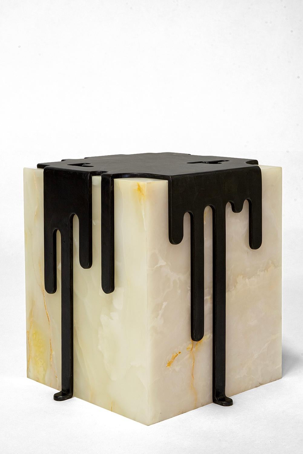 Table No. 17 
J.M. Szymanski
d. 2023
 
Imagine melting ice cream on a hot summer’s eve. These table sculptures represent joy and celebration. Each unique slab of onyx is carefully hand-picked. 3/8’’ thick solid blackened steel “drips” over the edges
