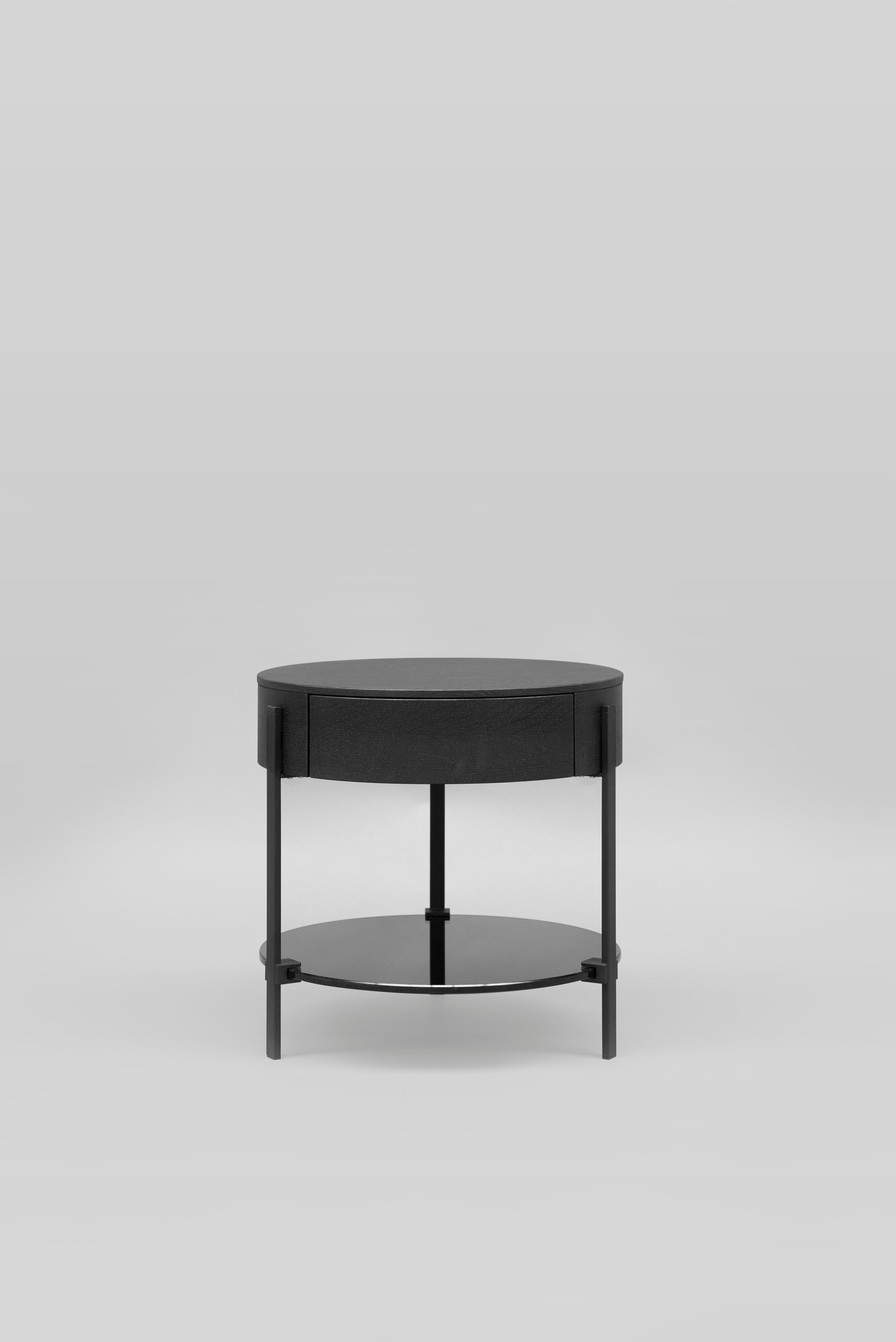 The 21st century Alice T79L side table was designed by Peter Ghyczy in 2015 and hand-crafted in the GHYCZY atelier in the south of the Netherlands, with a select group of artisans. The Alice T79L side table features a minimalist metal frame of